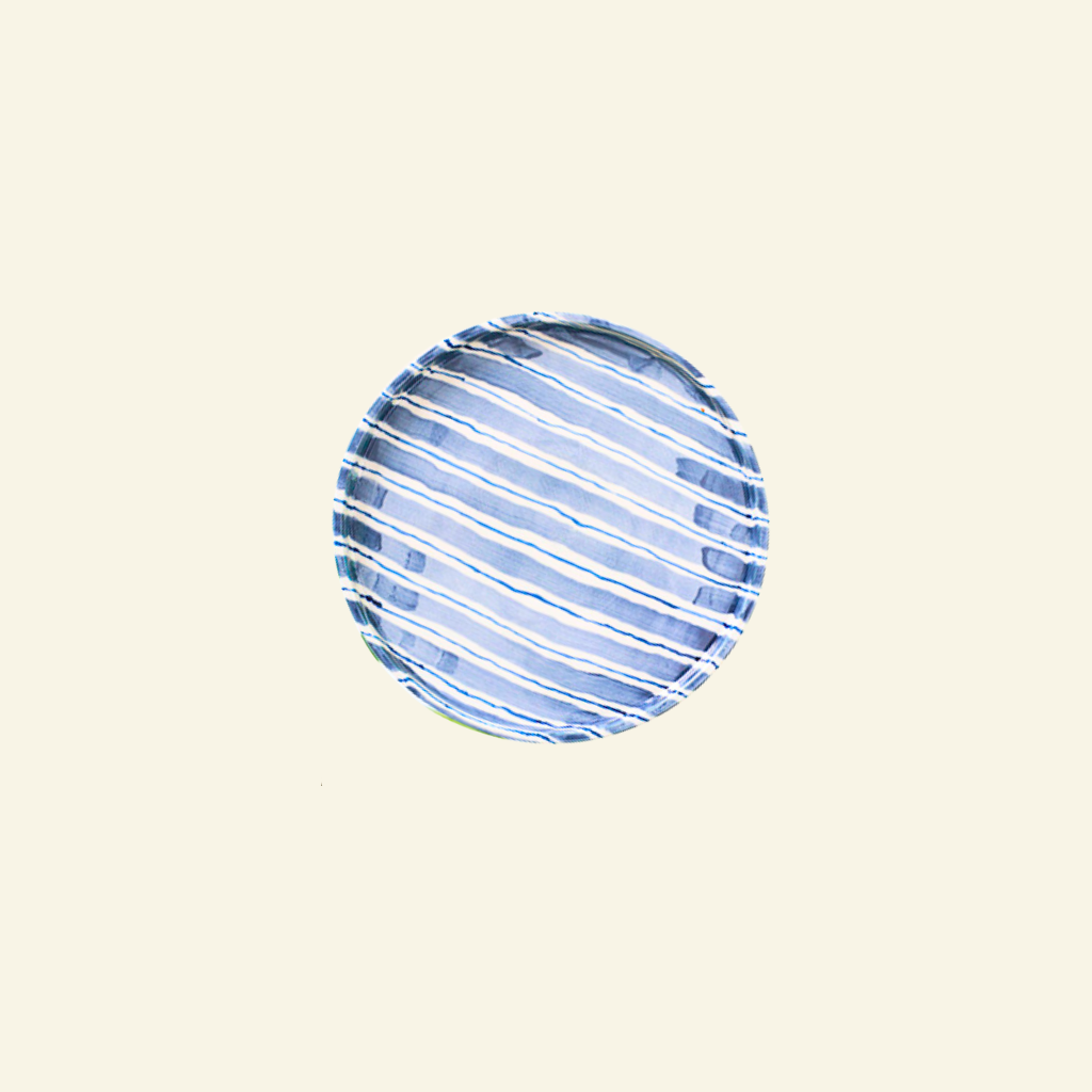 Blue and white striped artisan handmade ceramic plate on a beige background