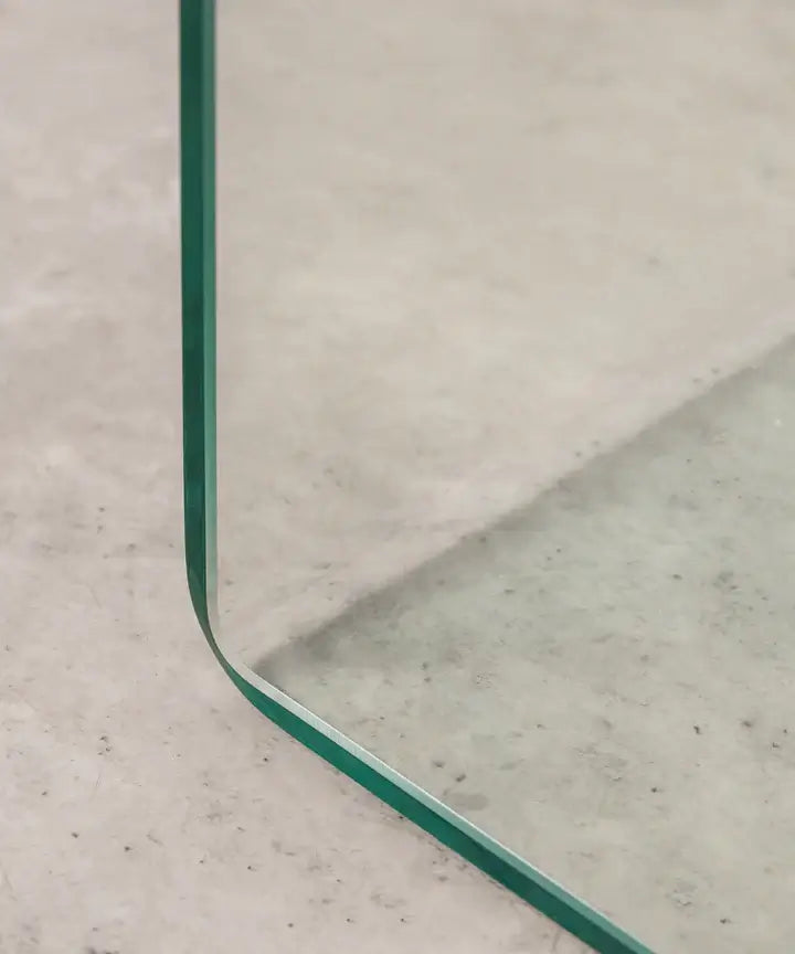 Zoomed-in view of transparent acrylic corner with greenish tint – premium craftsmanship of curved C-table design.