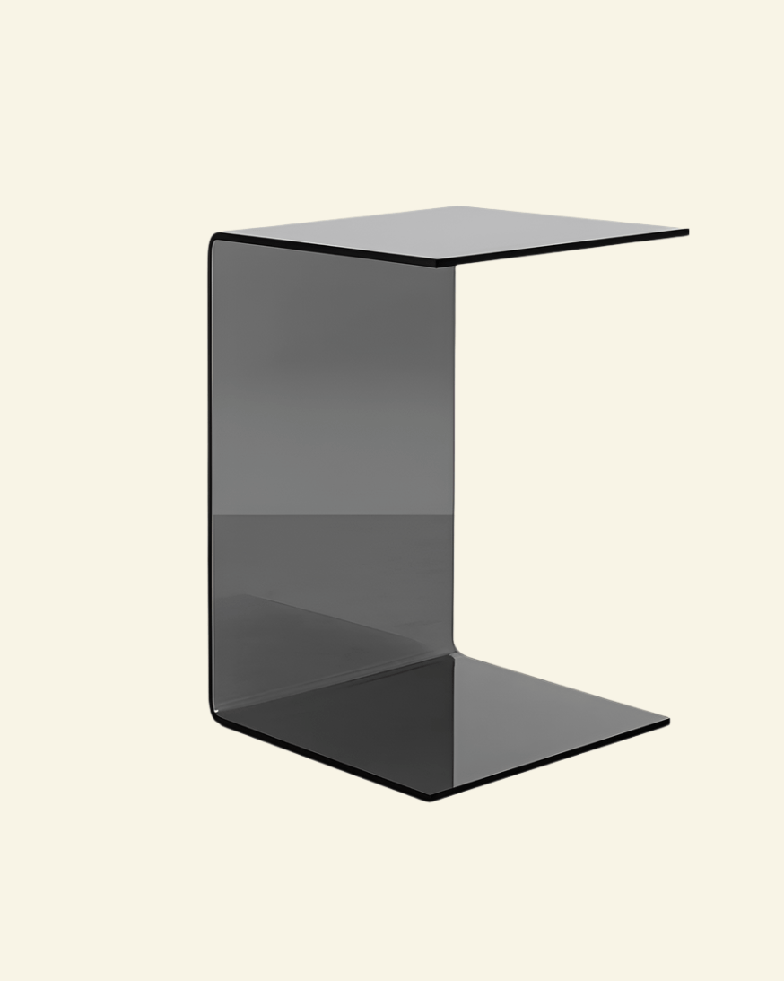 C-shaped side table in gray on neutral background – minimalist designer furniture for living rooms and bedrooms.