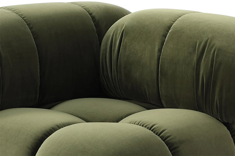 Close-up of a green camaleonda sofa replica with plush cushions on a white background