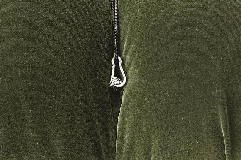 Close-up of a green fabric from the camaleonda replica with a zipper and silver zipper pull.