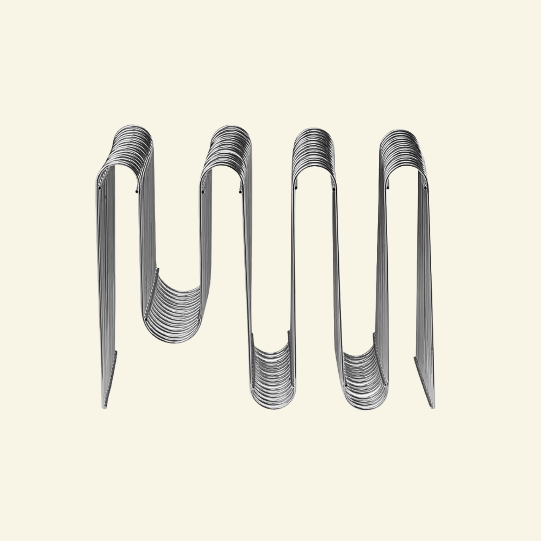 Chrome Curved Magazine Rack on beige background