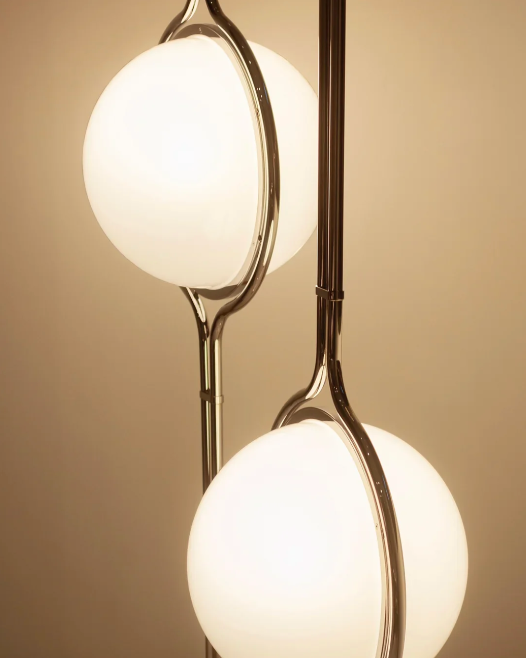 Close-up of Floor to Ceiling Ball Globe Lamp Retro Lamp by vibehaus with spherical glass shades on a beige background