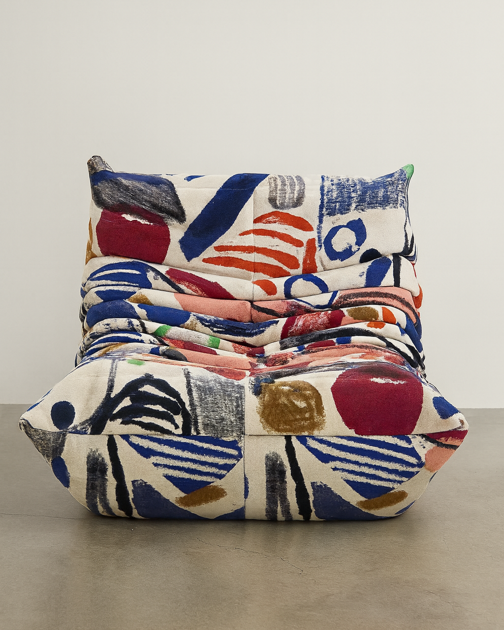 Graffiti-inspired Togo-style sofa set with velvet suede upholstery and a low, frameless caterpillar design for modern living spaces.