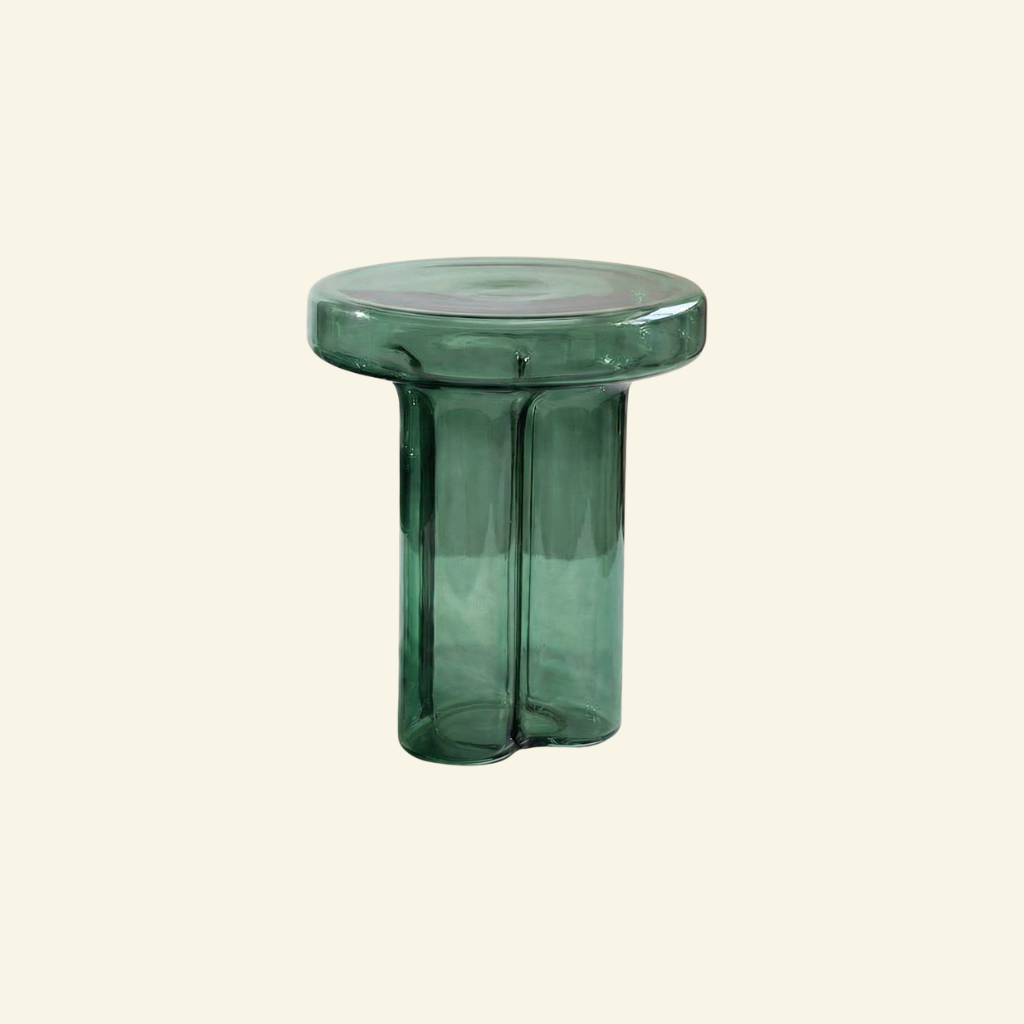 Tall Green glass side table on a beige background