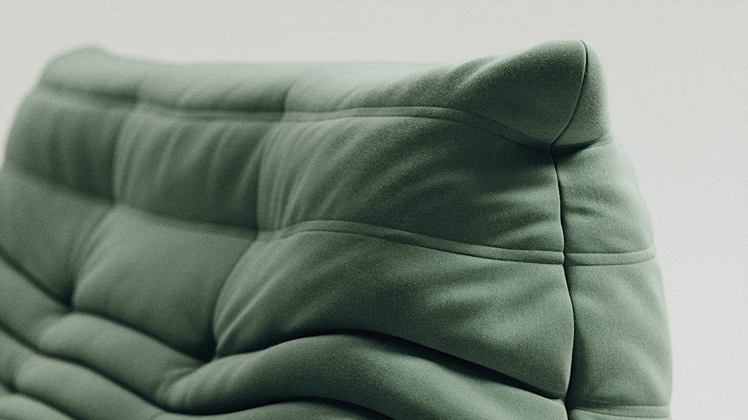 Green Togo-style sofa set with velvet suede upholstery and a low, frameless caterpillar design for modern living spaces.