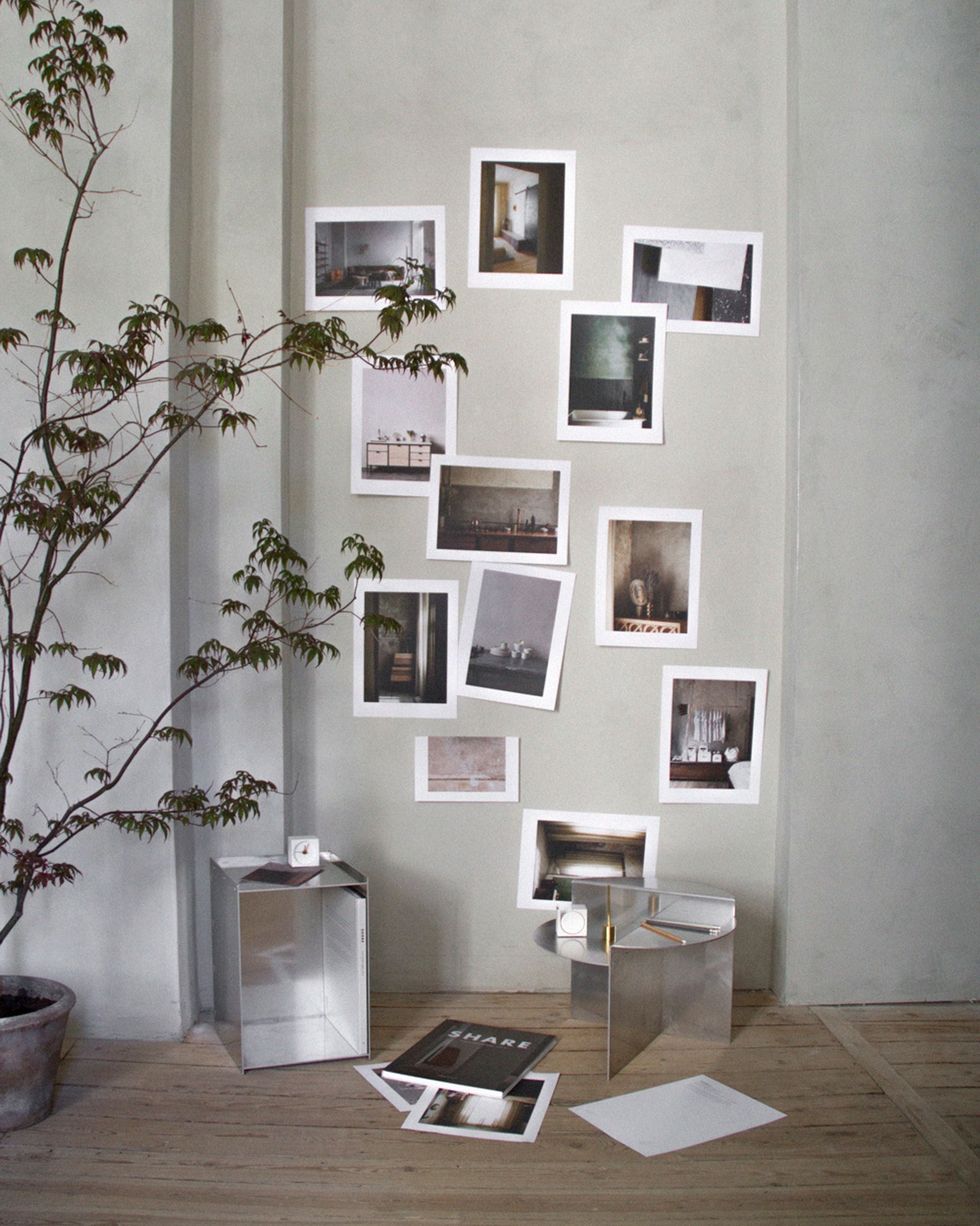 Artistic stainless steel side table with bold silhouette – modern home decor for creatives and designers