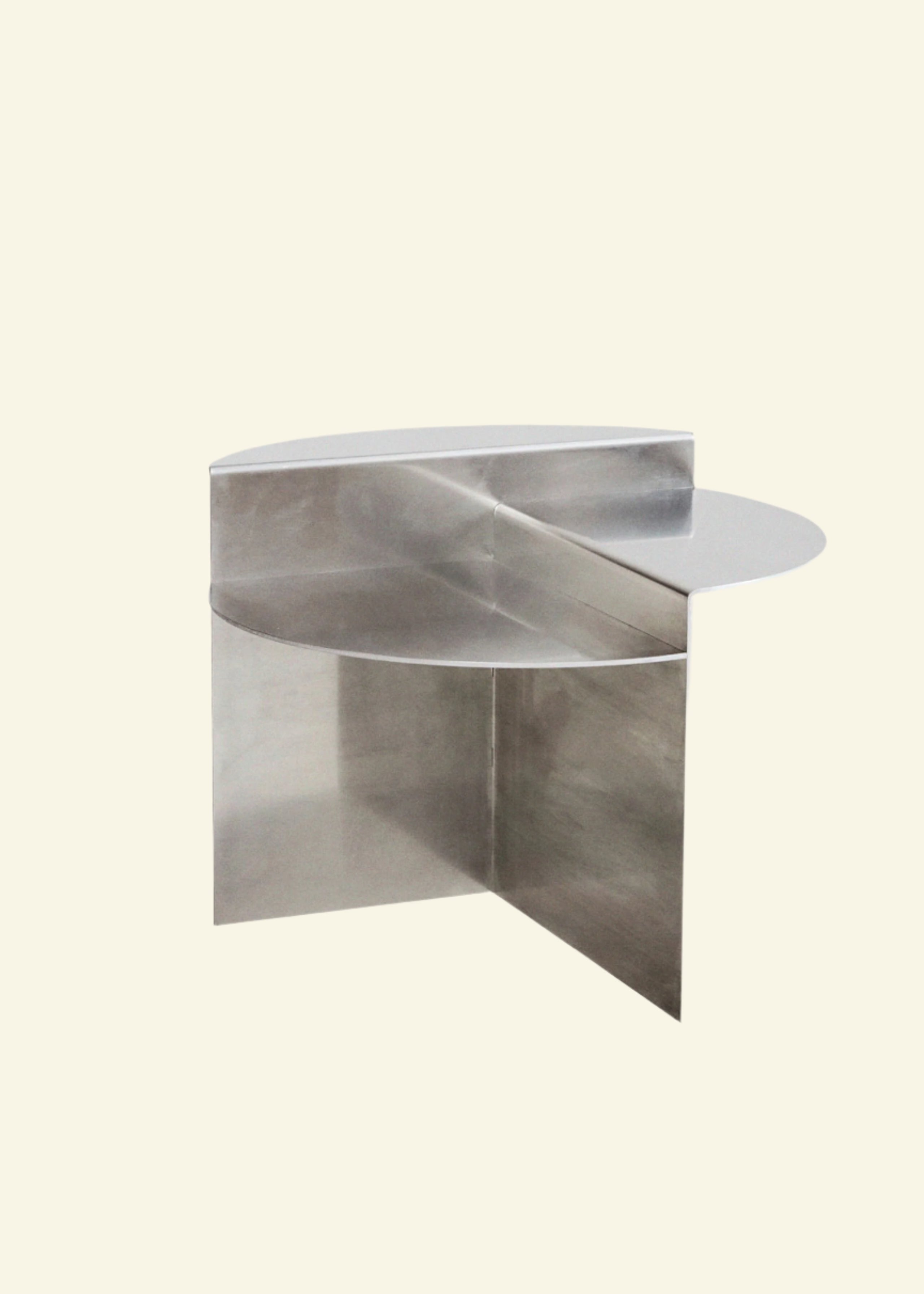 Modern geometric side table in polished chrome – sculptural stainless steel furniture for contemporary interiors