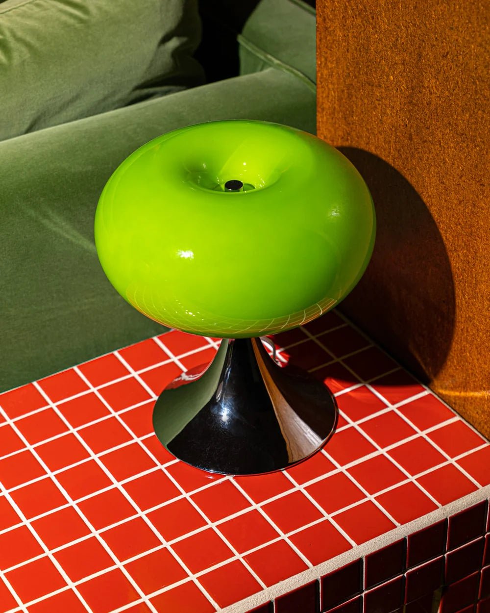 Modern round table lamp with Bauhaus-inspired design in clear glass and sleek metal accents.