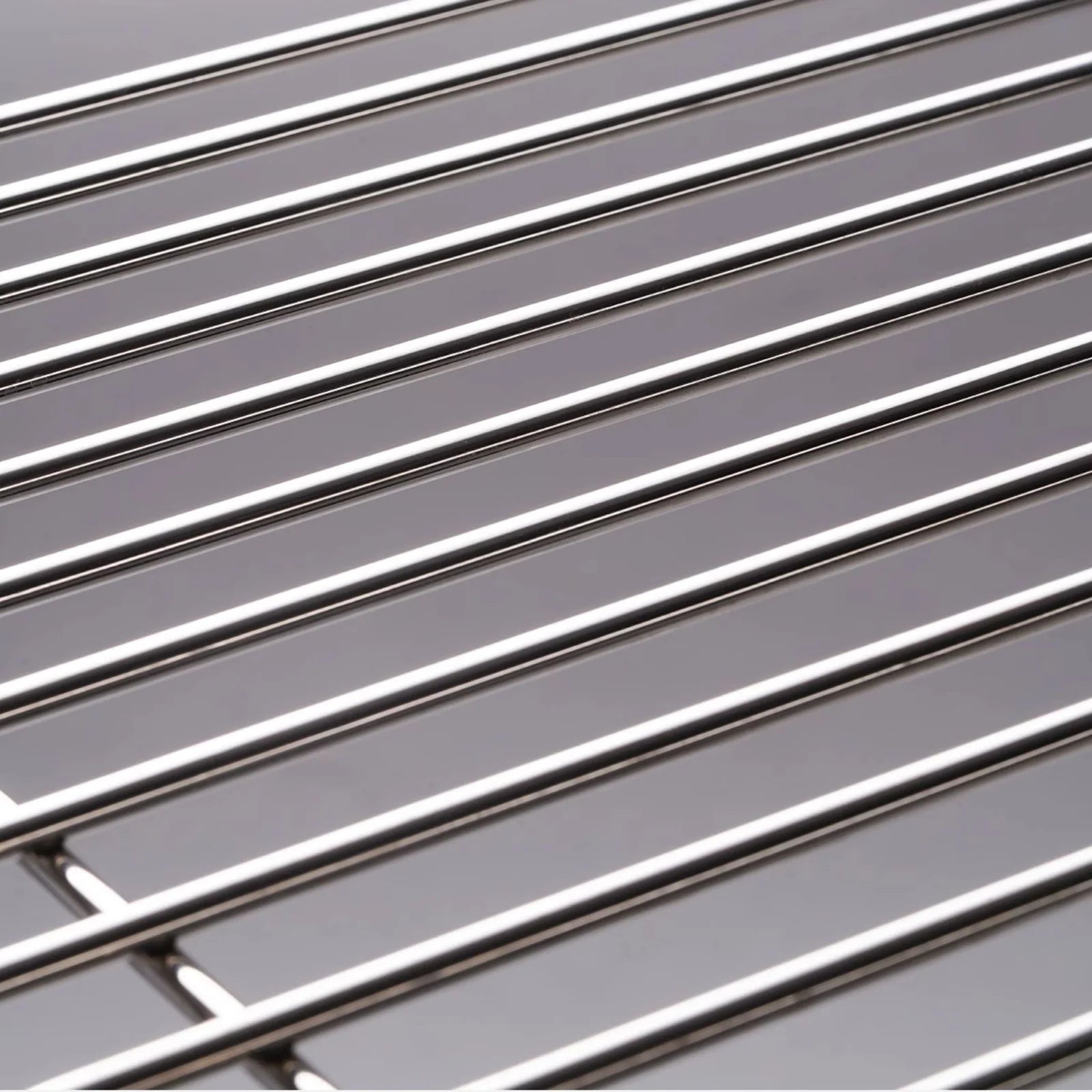 Detail view of the chrome wireframe construction of the modern wire side table, highlighting its polished finish and modular build.