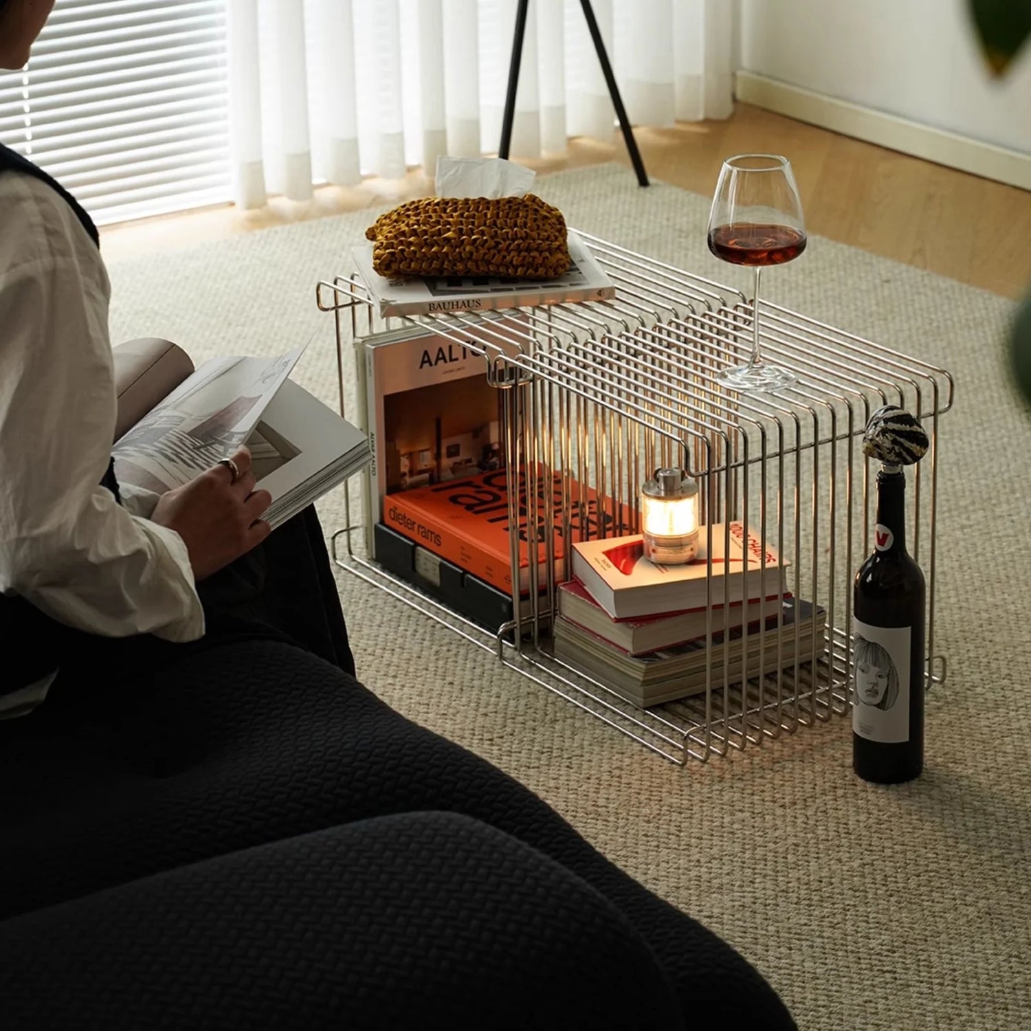 Stacked chrome wire cubes styled as a modular coffee table and shelf, showcasing the table’s versatility and clean Nordic design.