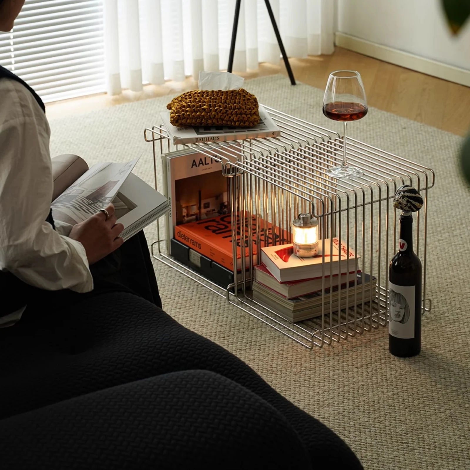 Stacked chrome wire cubes styled as a modular coffee table and shelf, showcasing the table’s versatility and clean Nordic design.