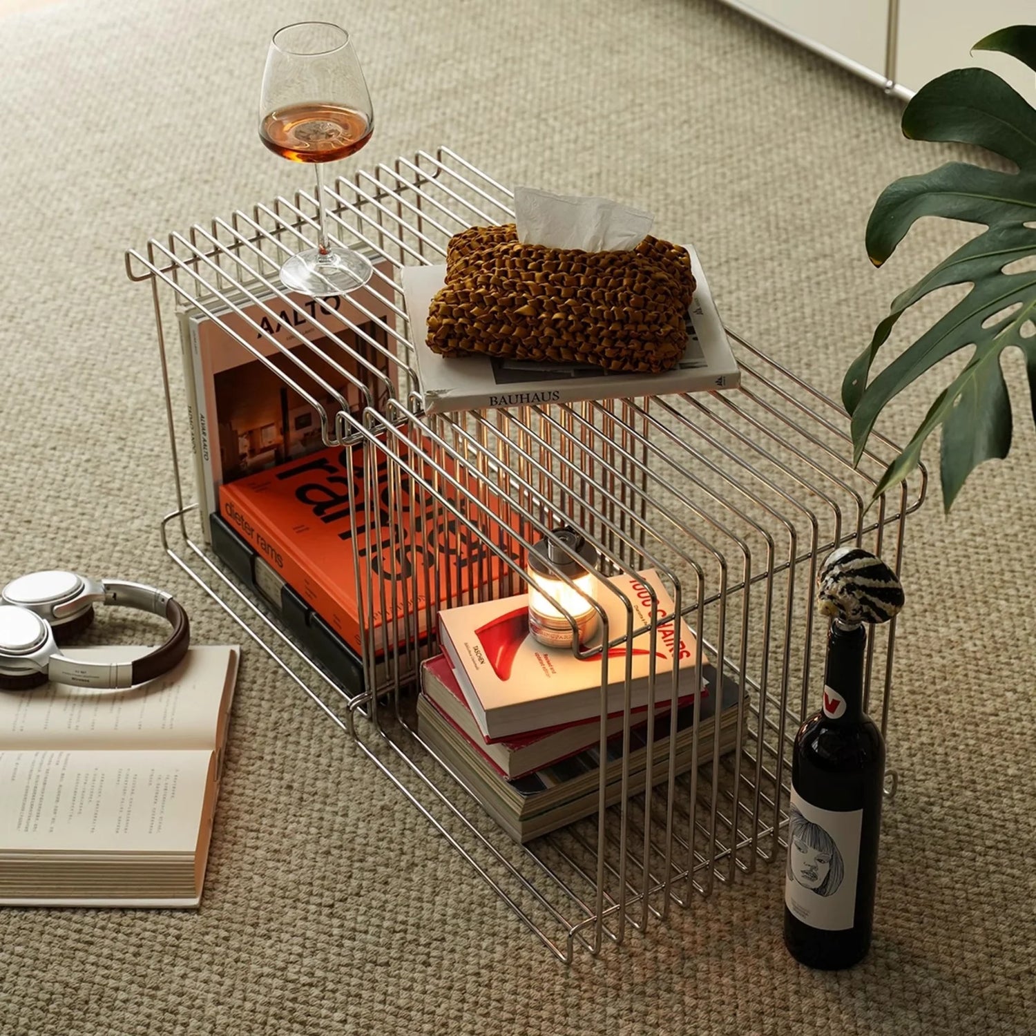 Stacked chrome wire cubes styled as a modular coffee table and shelf, showcasing the table’s versatility and clean Nordic design.