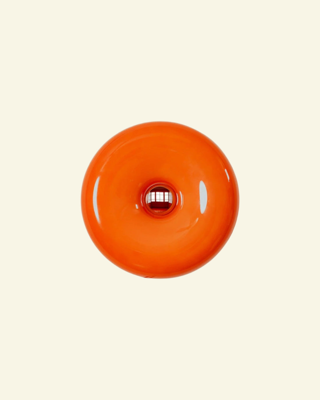 Orange donut lamp with round Bauhaus-inspired design, crafted from glass and iron by Vibehaus.