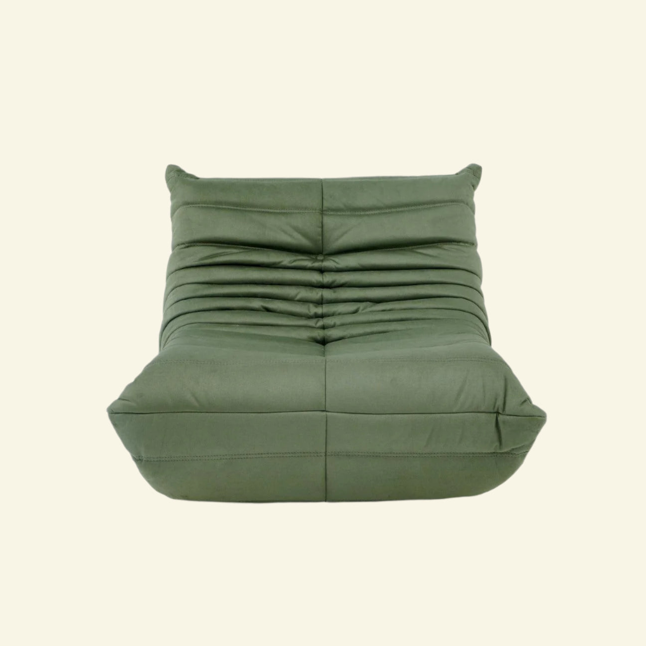 Replica of the green velvet Togo-chair by michael ducaroy– low, frameless design with plush channel tufting