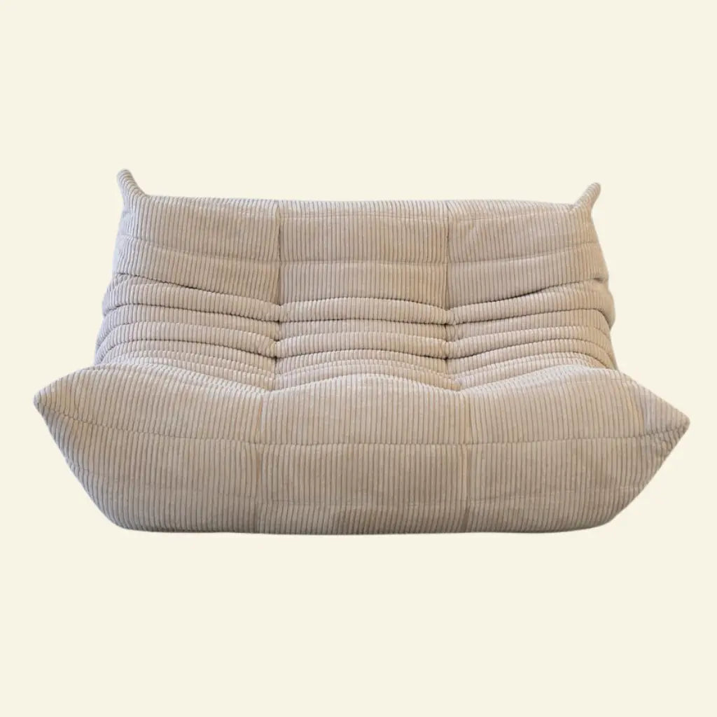 beige corduroy replica dupe of the Togo 2-seater sofa by ligne roset – low, frameless design with plush channel tufting