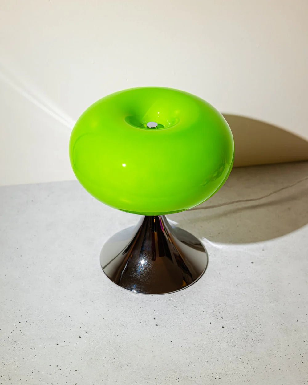Round Apple table lamp in green, curved glass and brushed metal, modern round lamp inspired by Bauhaus style.