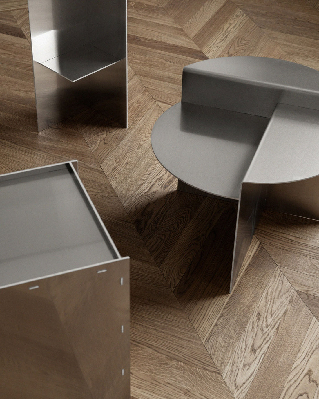 Sleek chrome side tables with bold geometric design – perfect for modern living rooms or designer spaces