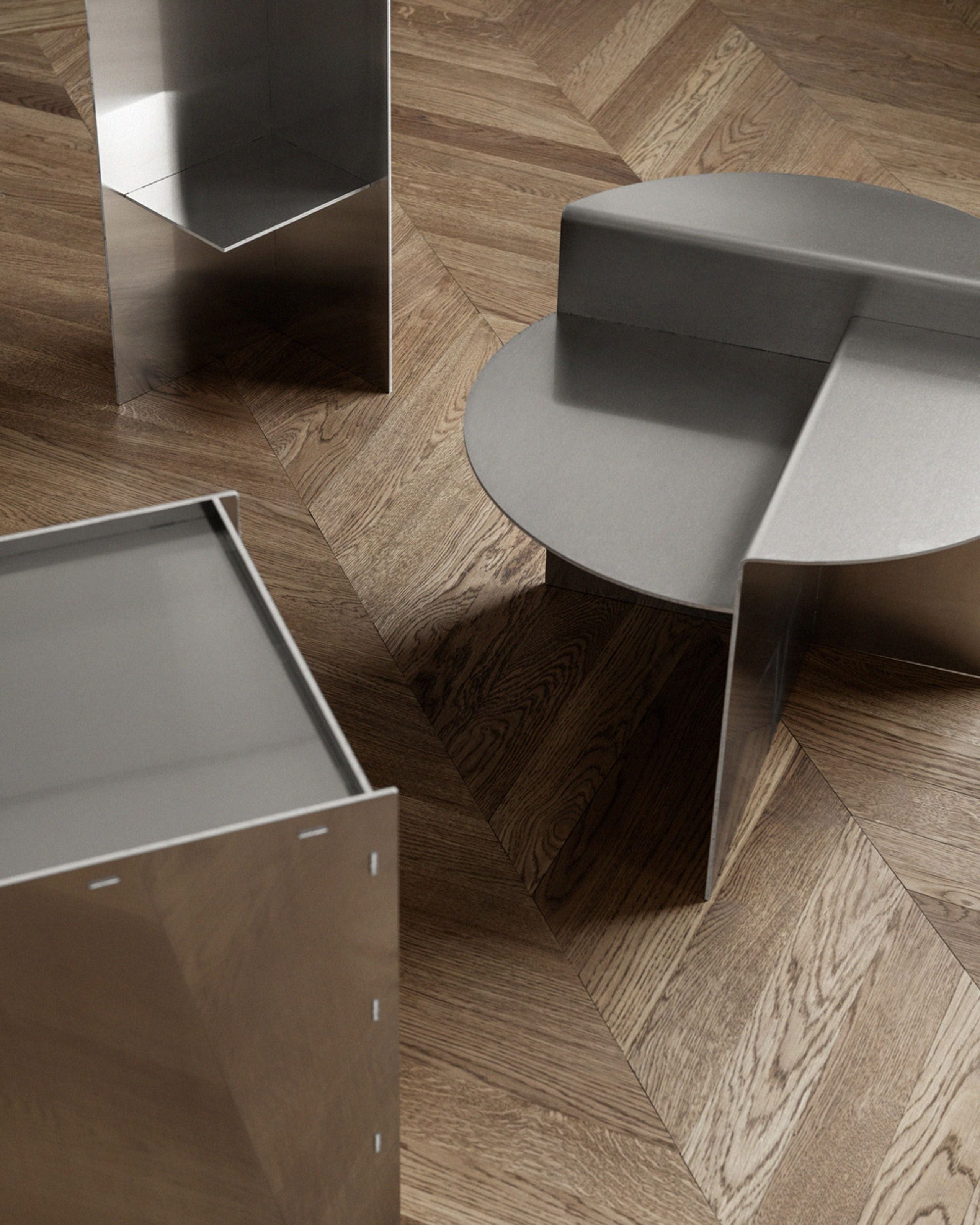 Sleek chrome side tables with bold geometric design – perfect for modern living rooms or designer spaces