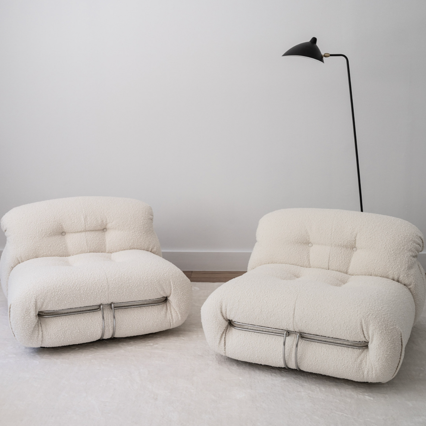 Soriana-inspired chairs in soft white lambskin with chrome frame, perfect for cozy modern living spaces