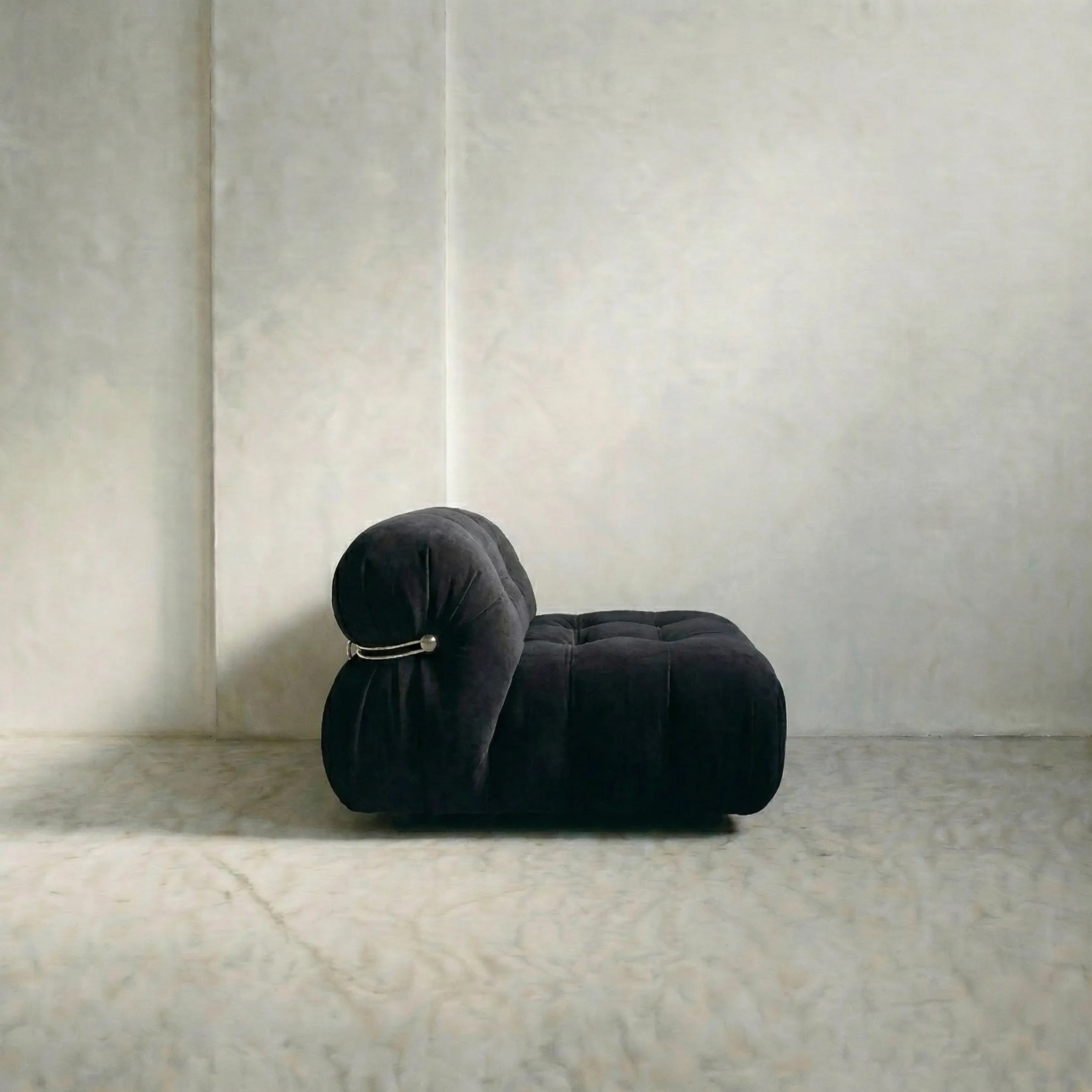 soriana sofa 2-seater dupe in black flannel close-up with chrome frame detail on light gray surface