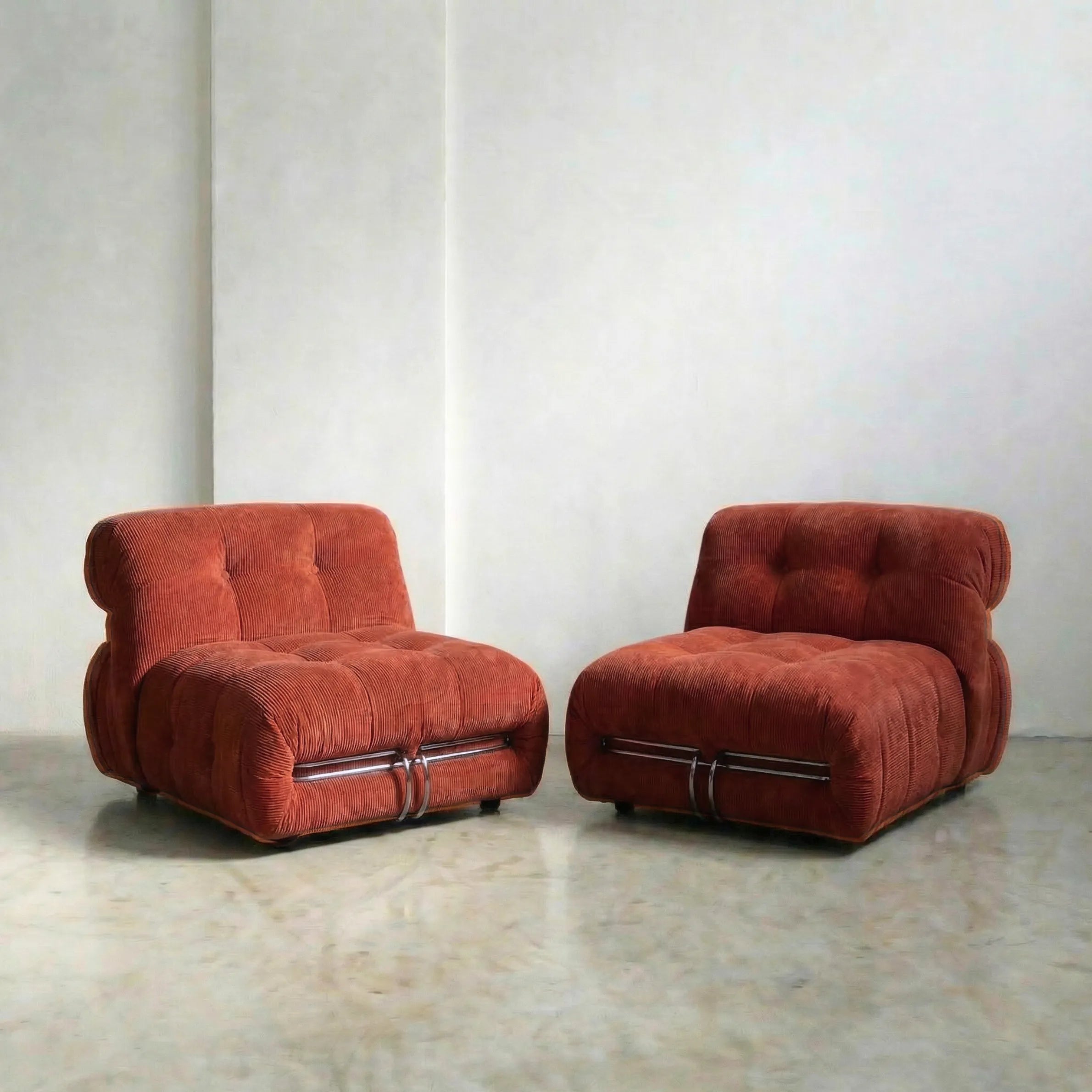 soriana chair dupe in terracotta corduroy on gray floor with white wall background