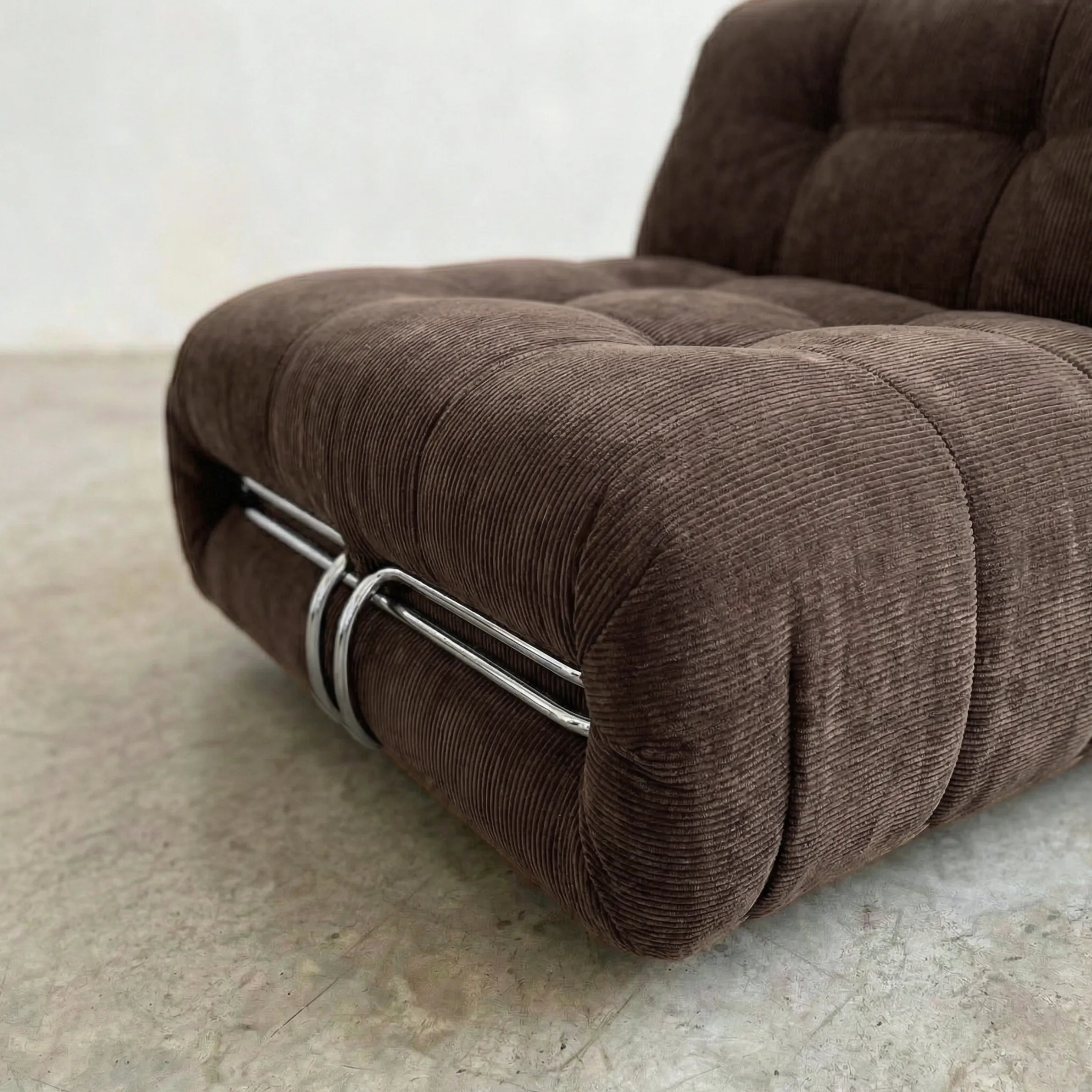 soriana chair dupe in chestnut corduroy close-up with chrome clamp detail on light background