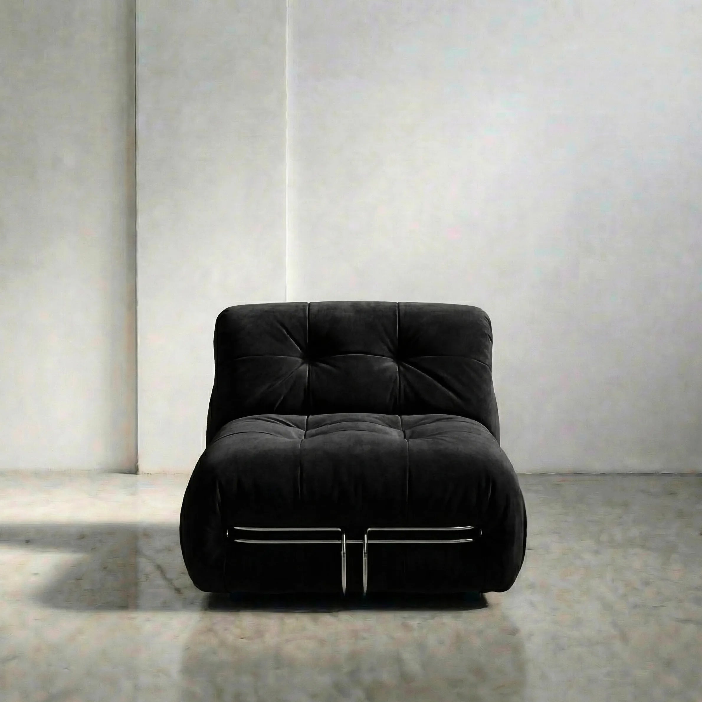 soriana chair dupe in black flannel close-up with chrome frame detail on light gray surface