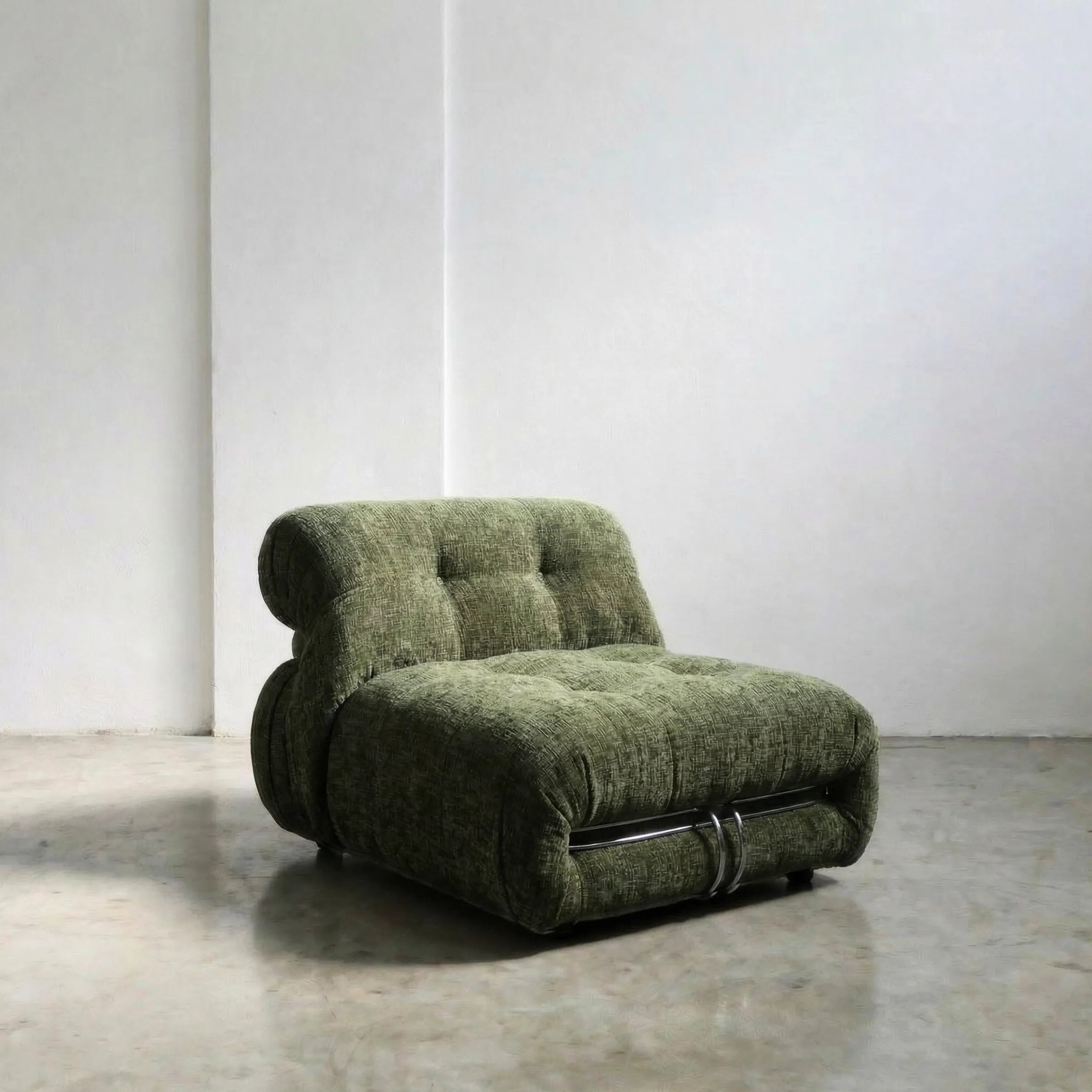 soriana chair dupe in green chenille on gray floor with white wall background