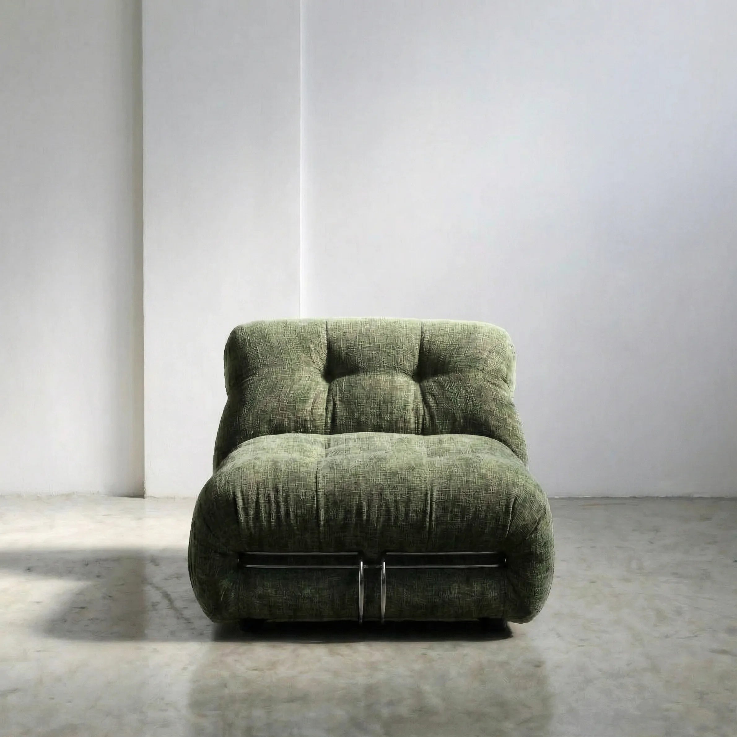 soriana chair dupe in green chenille close-up with chrome clamp detail on light background