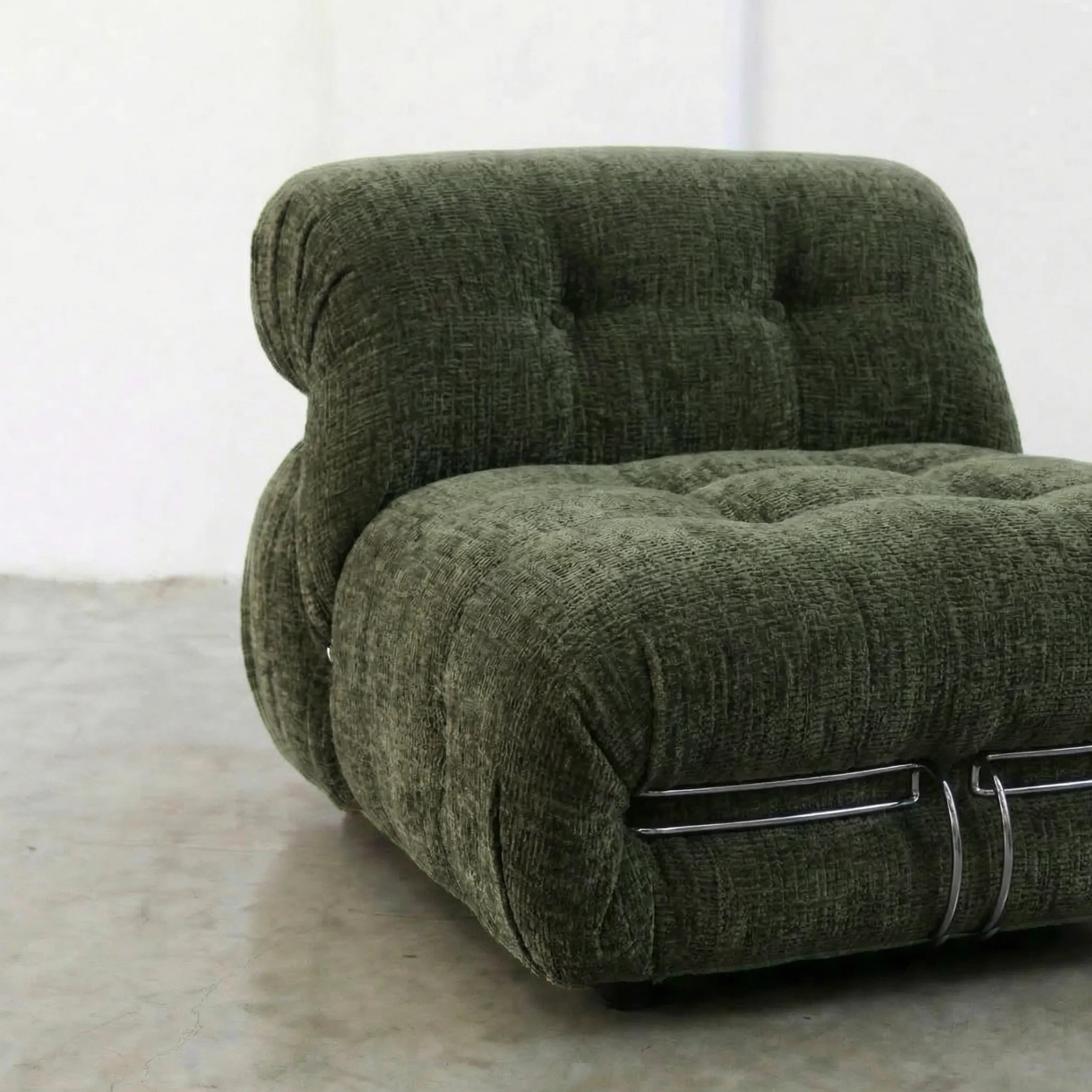 soriana chair dupe in green chenille close-up with chrome frame detail on light gray surface