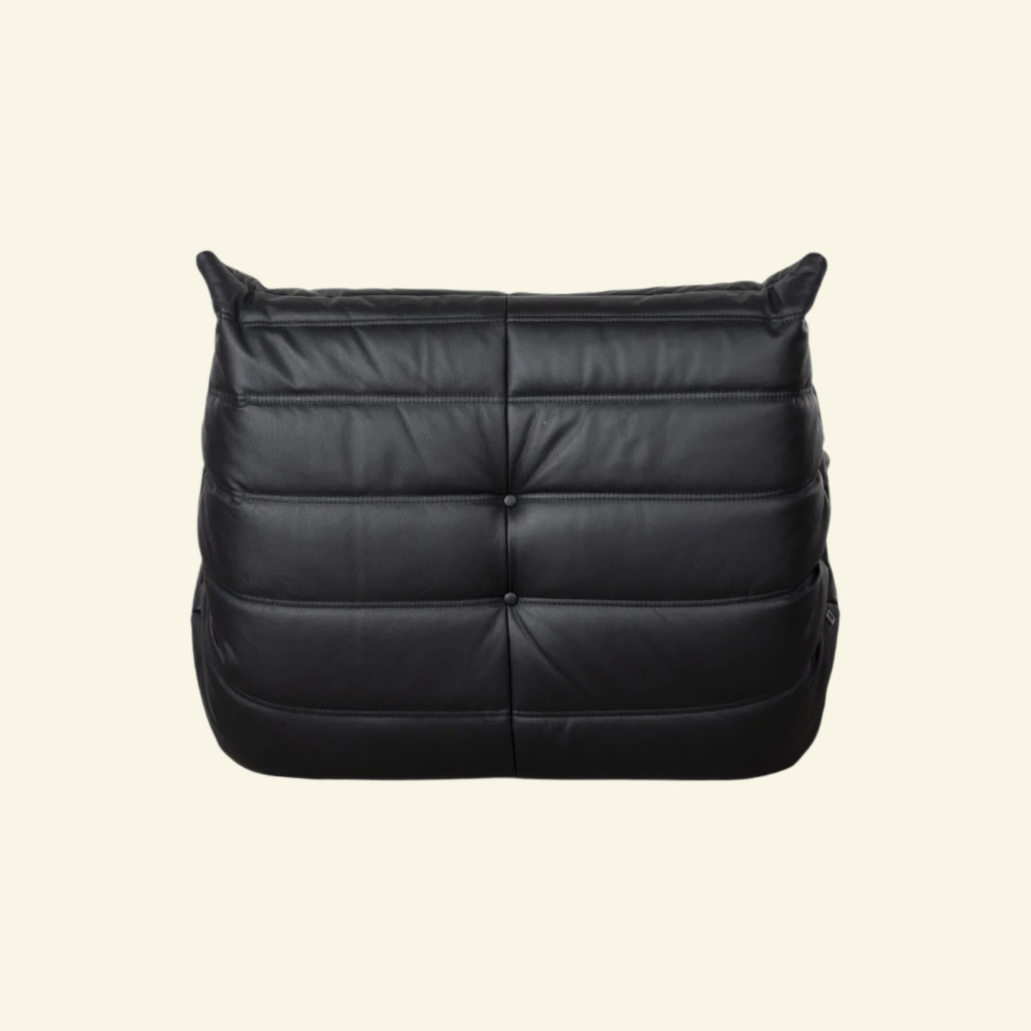 Black leather togo replica with a quilted design on a white background