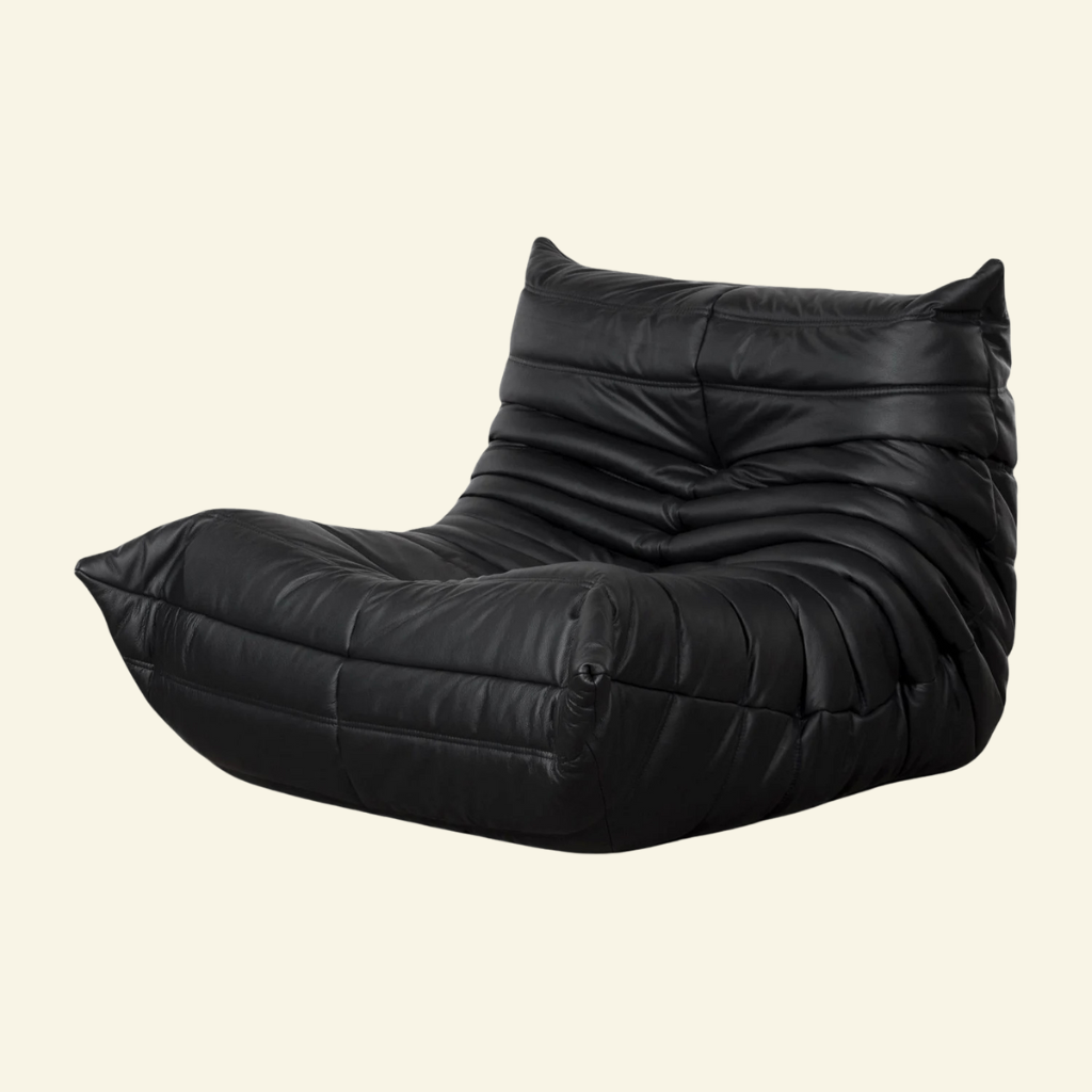 Black togo chair replica in leather on a beige background