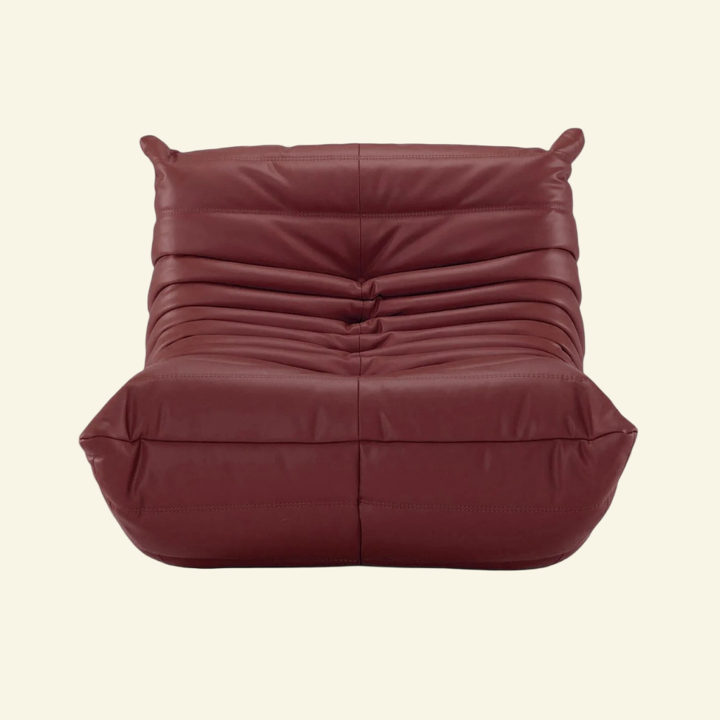 Maroon togo chair in leather on a white background