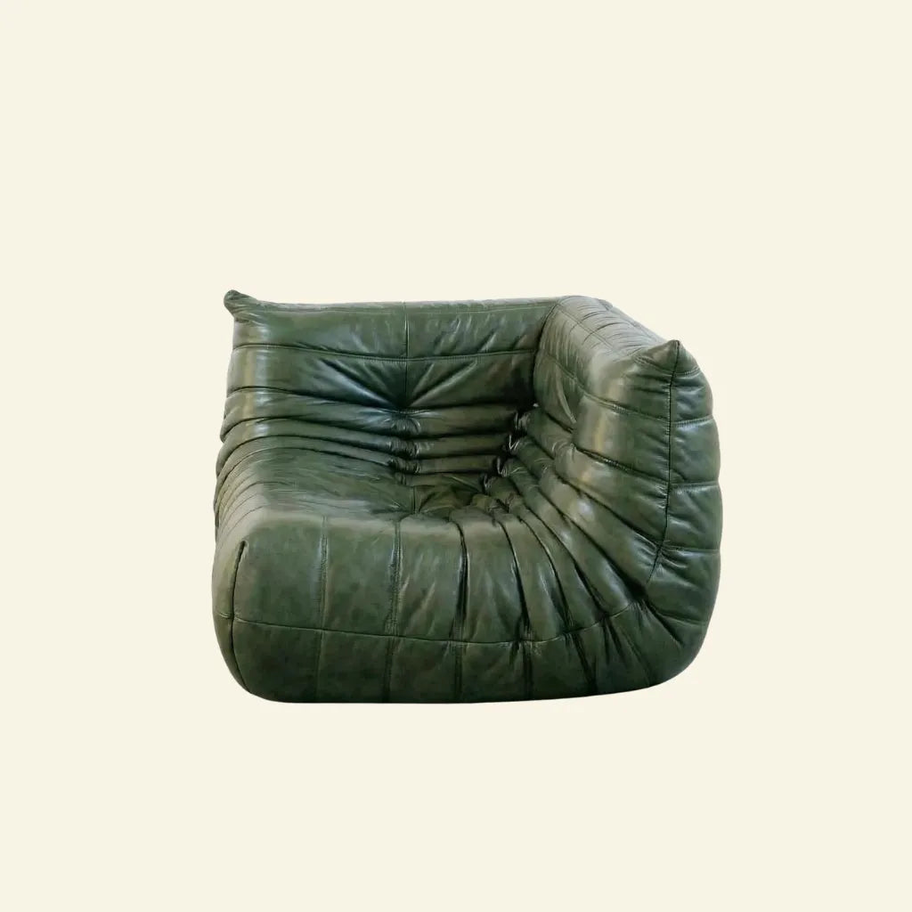 Green leather togo armchair dupe on a beige background