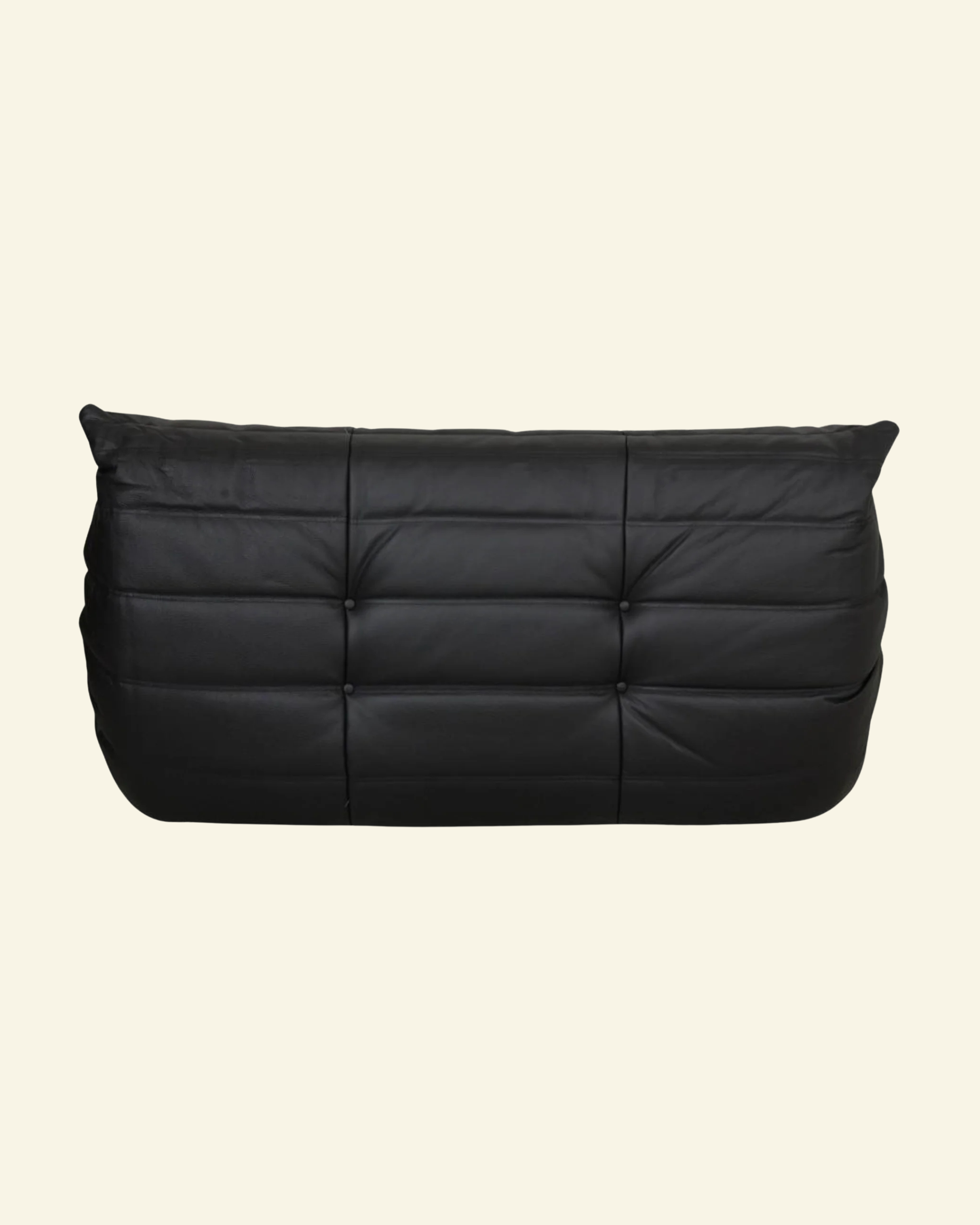 Togo black leather 2-seater dupe on beige backgorund