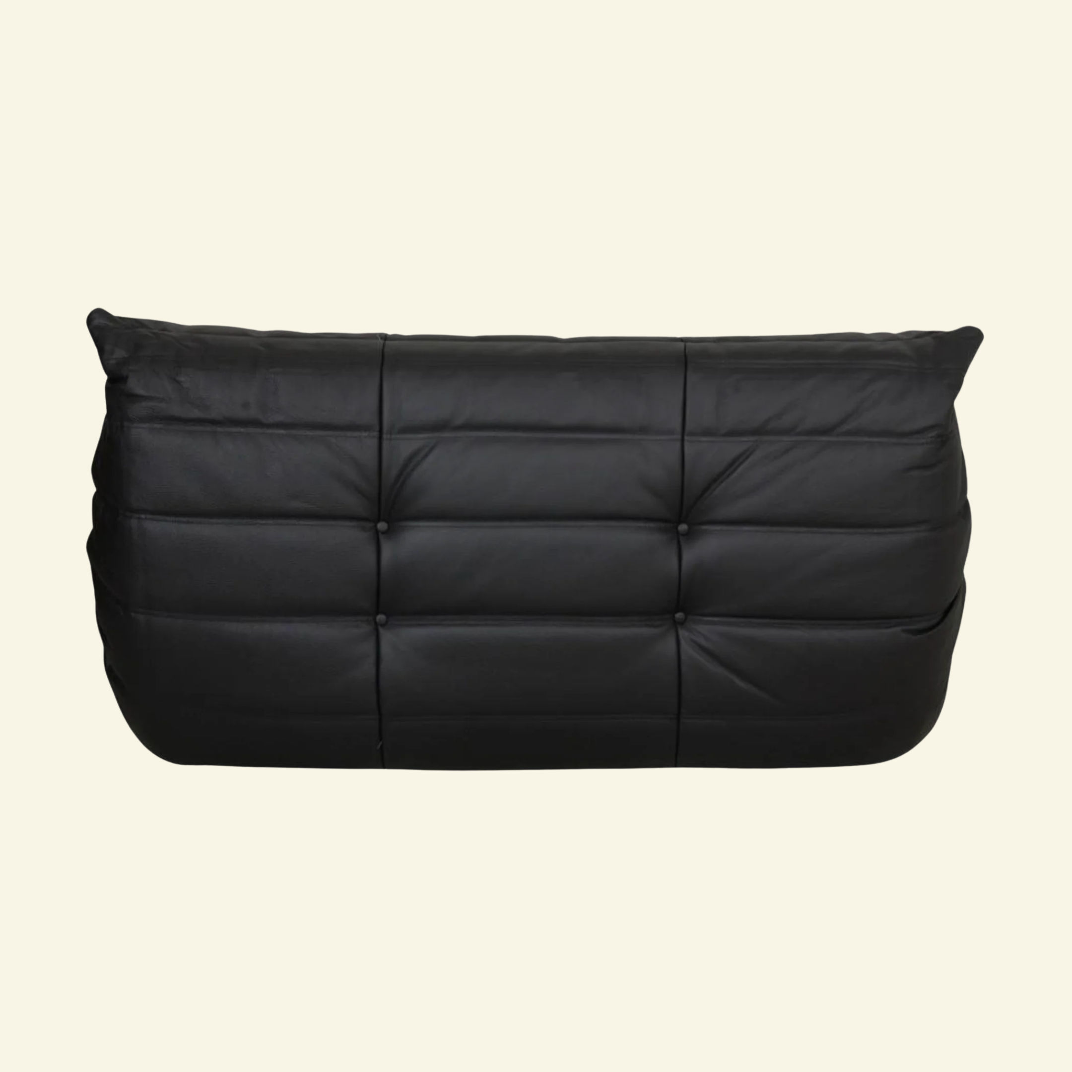 Togo black leather 2-seater dupe on beige backgorund