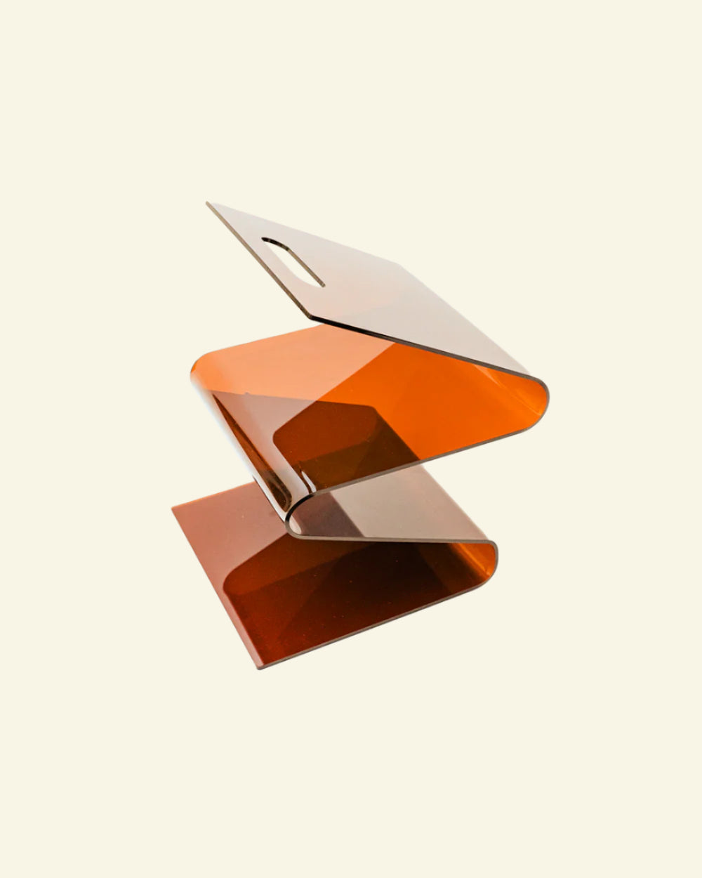Modernist wavy acrylic magazine rack with orange and brown design on a beige background