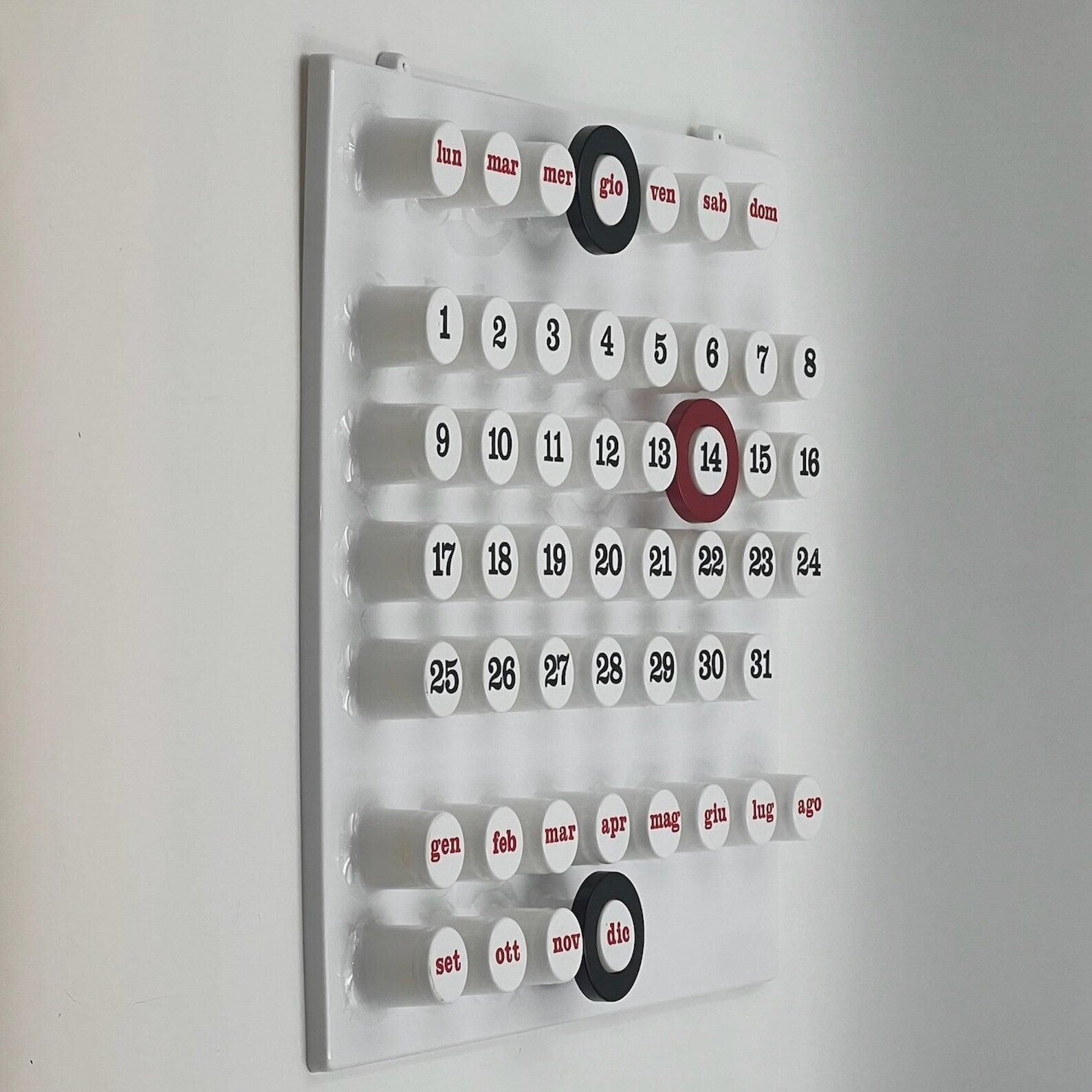 White Modern Ring-a-Date Calendar with circular design and daily ring system, perfect for adding function and Italian elegance to your walls