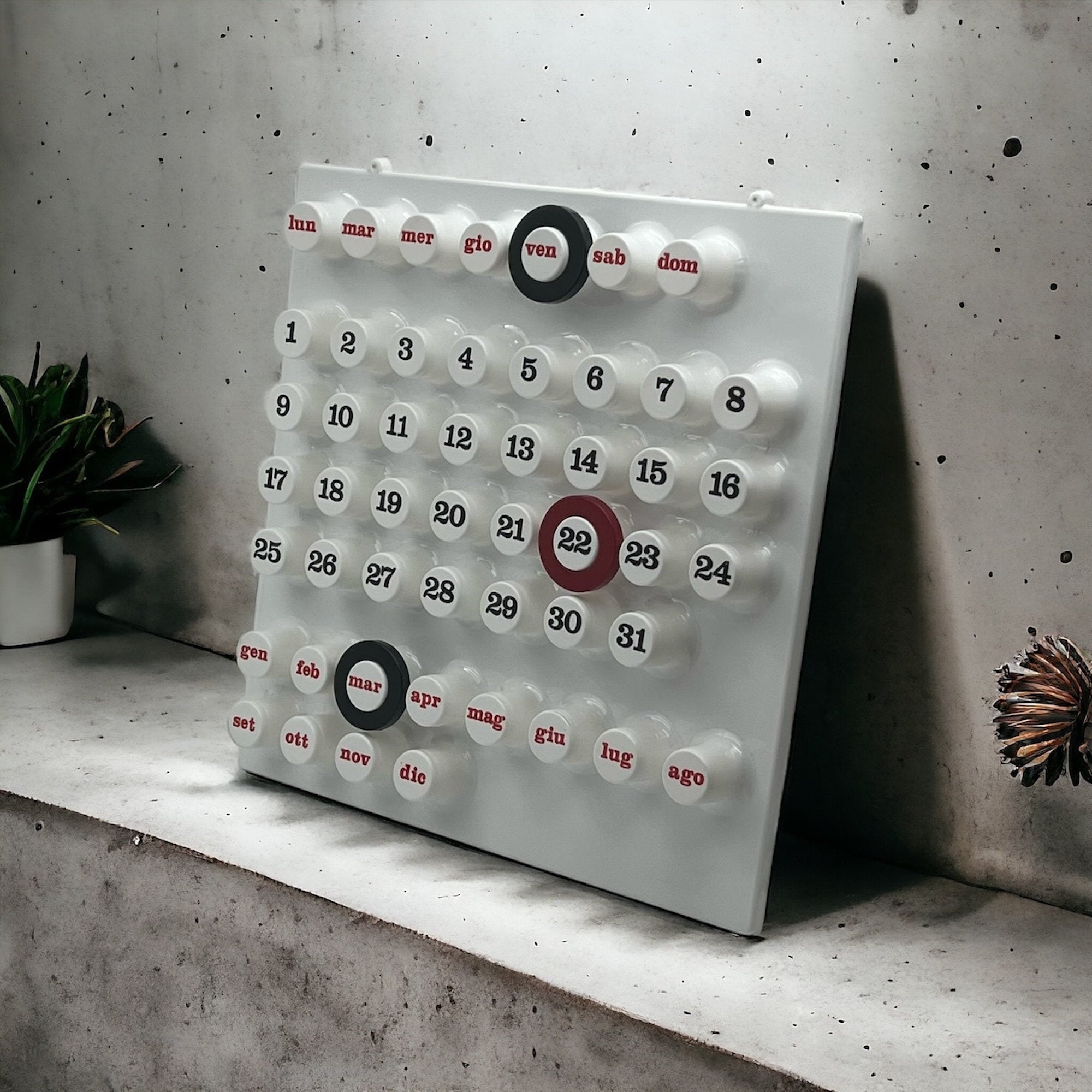 Minimalist perpetual wall calendar inspired by Italian designer Giorgio Della Beffa, made from lightweight, sustainable materials