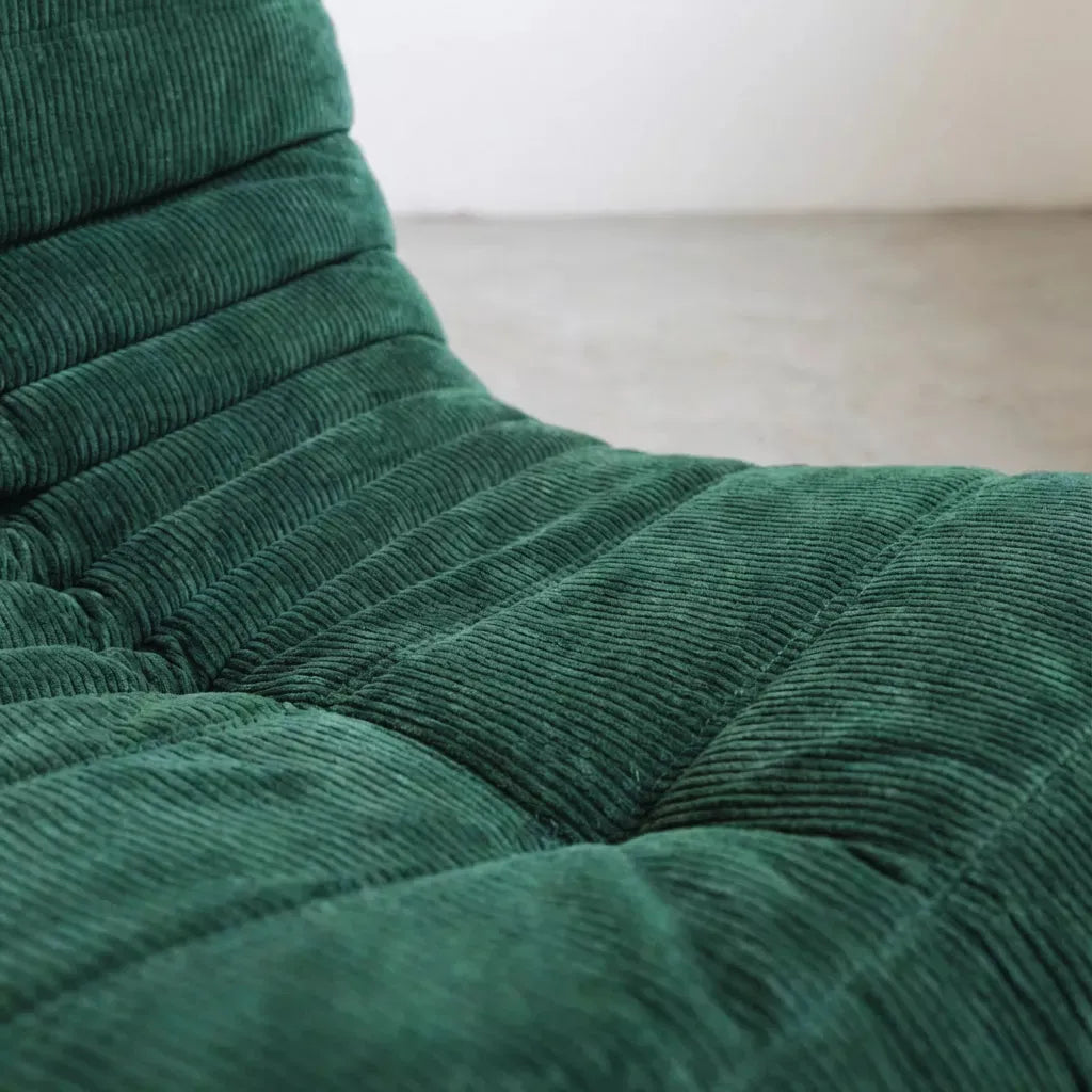 Handmade caterpillar sofa chair in corduroy green – plush high-density sponge filling for ergonomic comfort