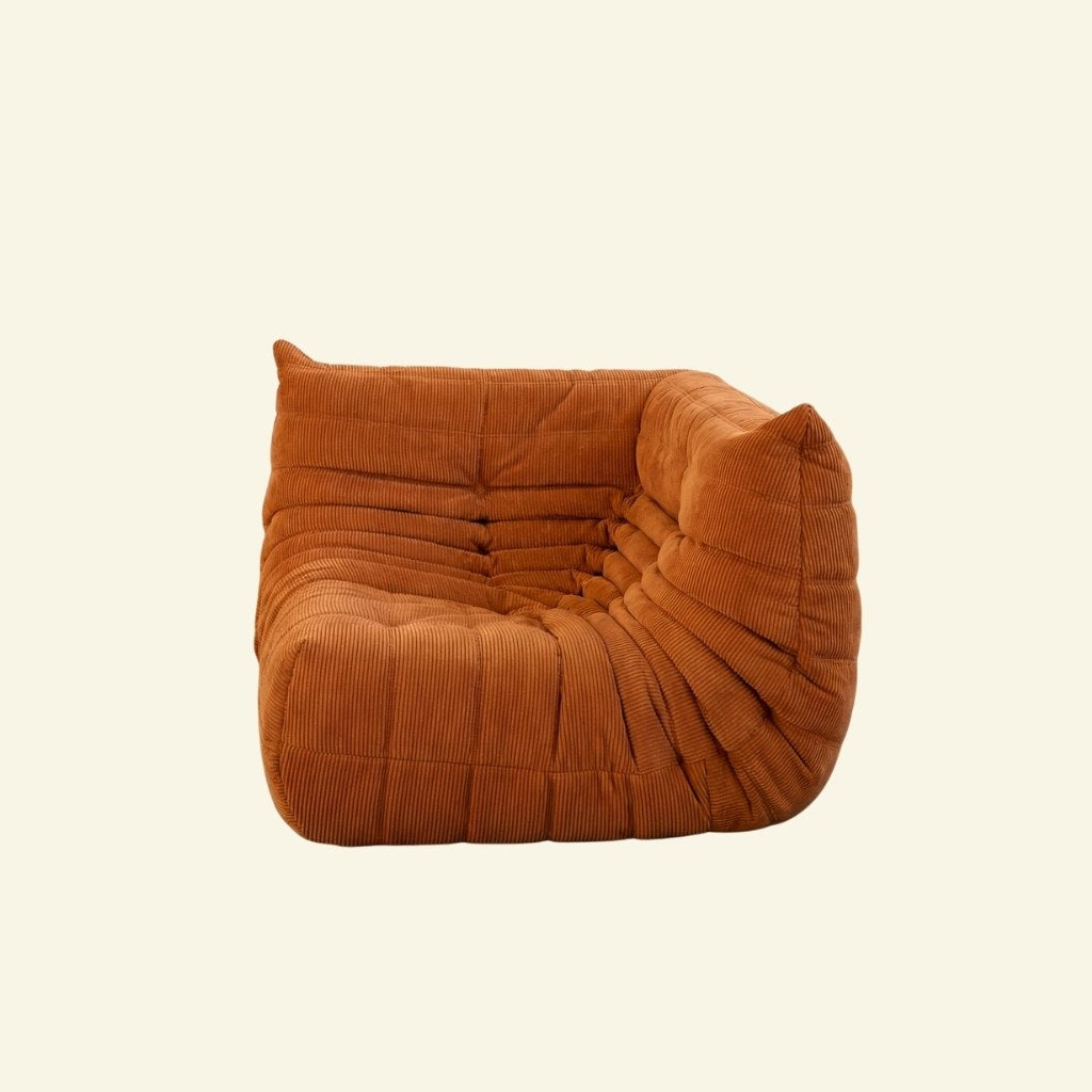 Bruma Sofa Corner in orange corduroy on a beige background