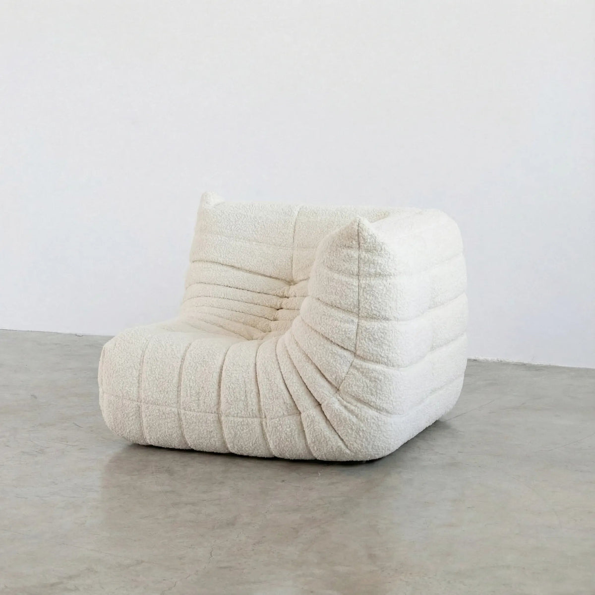 Bruma Sofa Corner in white bouclé photographed from the front angle.