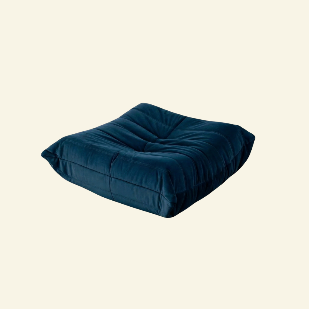 Bruma Ottoman in dark blue velvet on beige background