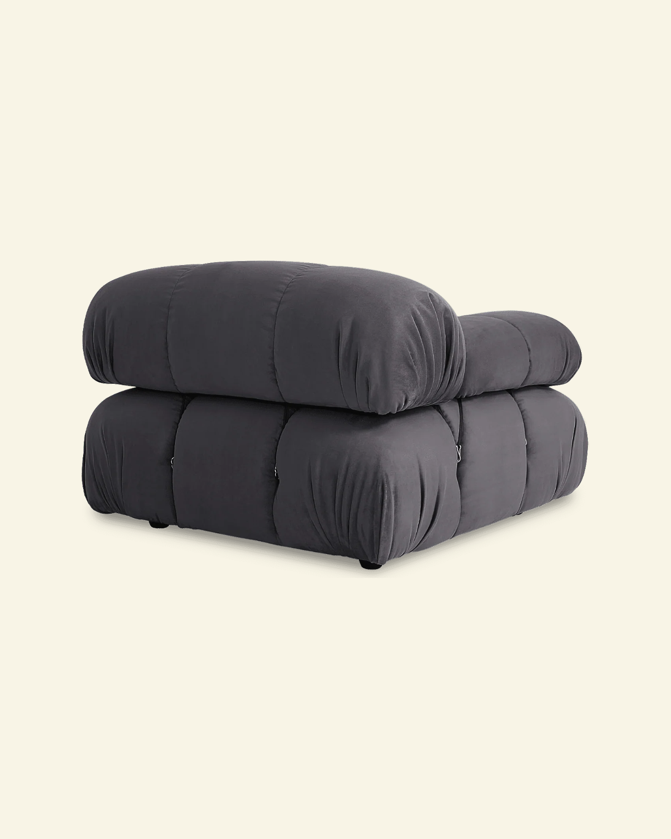 black camaleonda mario bellini replica chair on a beige background