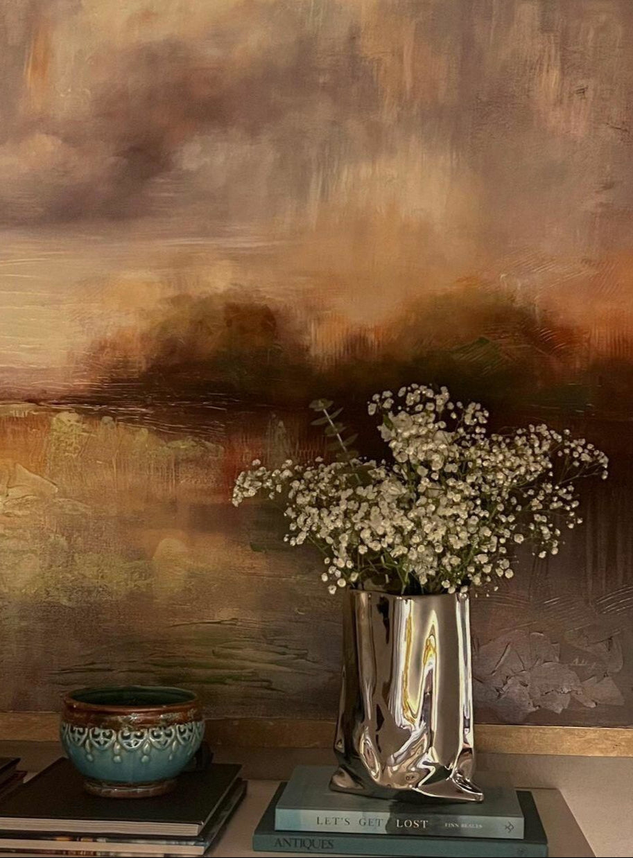 Silver metallic vase with a soft, crinkled design, made from high-quality ceramic — perfect for adding shine and texture to your space.