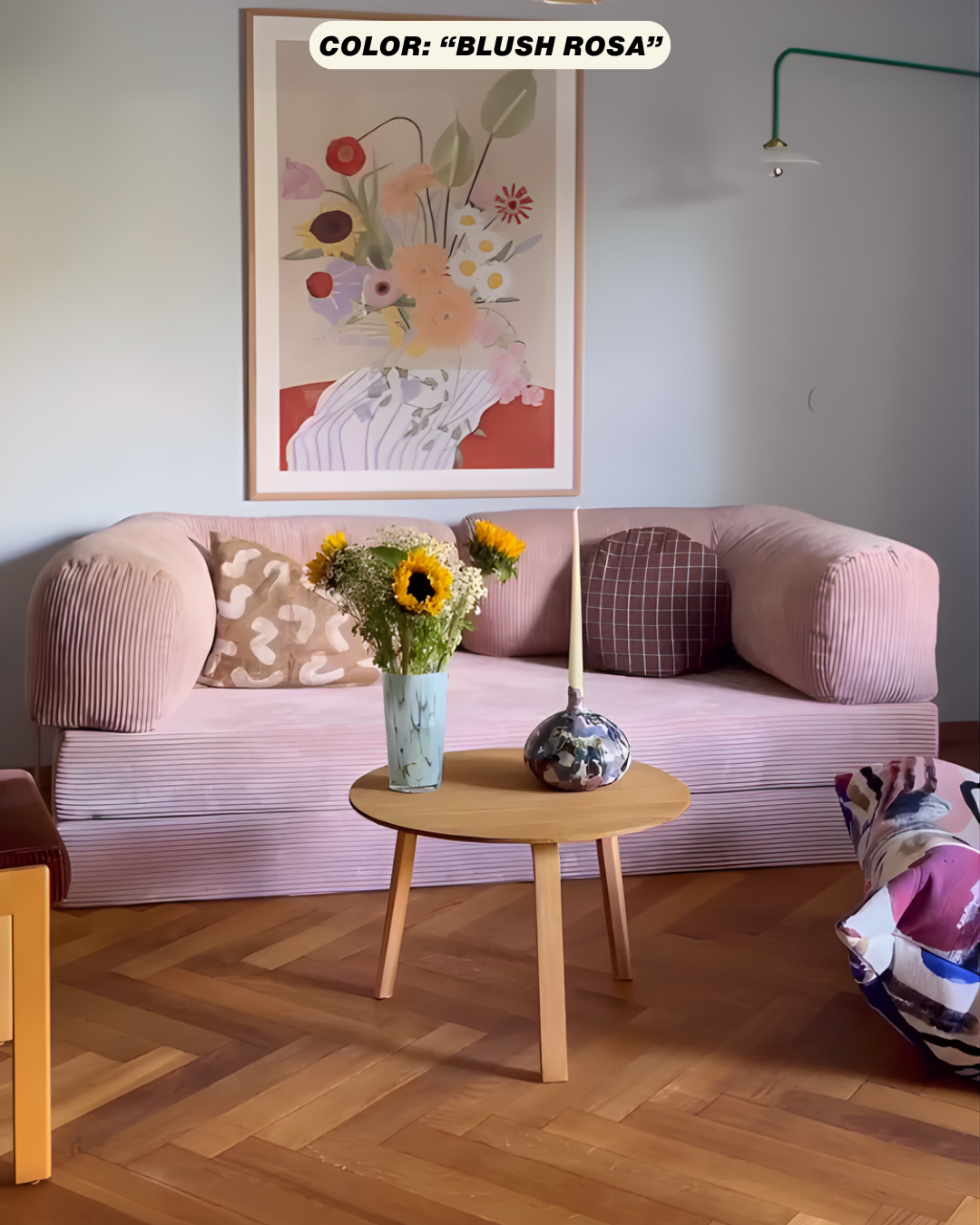 Living room with pink teddy sofa dupe, floral artwork, and wooden coffee table.