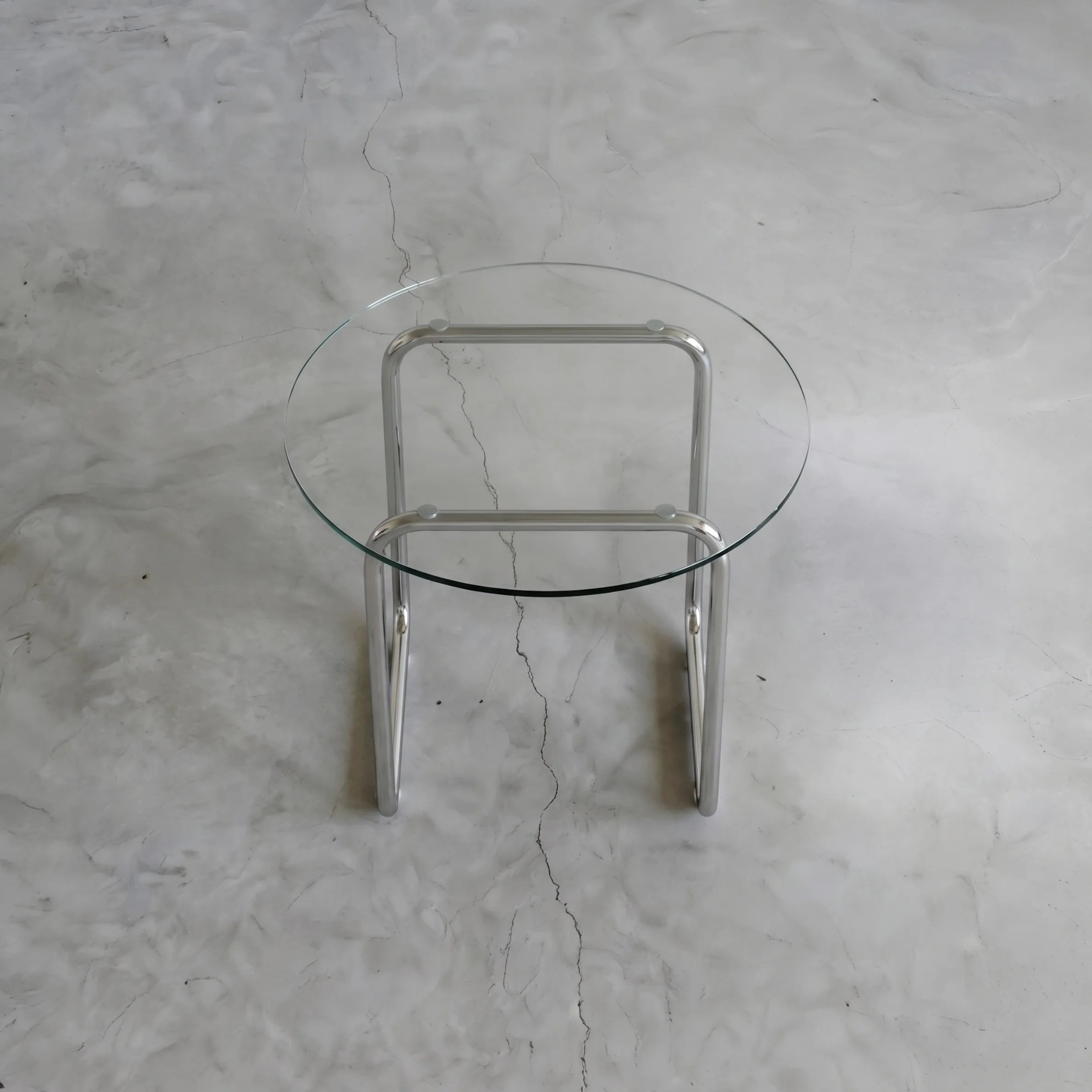 Orbit Round Glass Coffee Table, a round glass coffee table with a sculptural base for contemporary living rooms, detail view