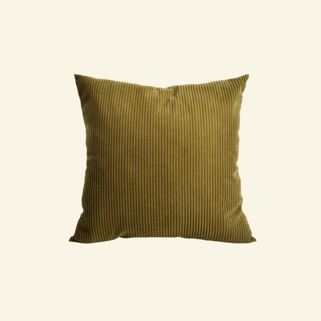 Green corduroy cushion with a ribbed texture on a white background