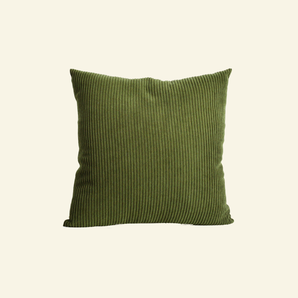 Green corduroy ribbed pillow on a white background